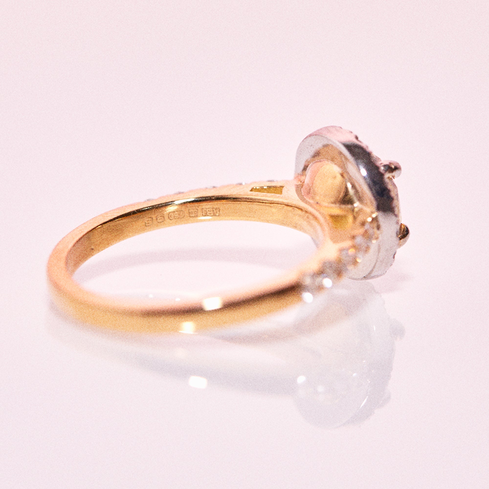 18ct yellow gold yellow diamond ring set with a diamond halo