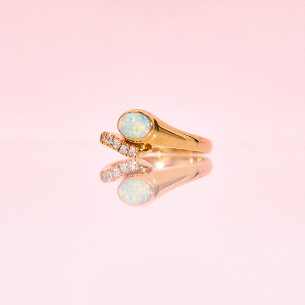 18ct gold snake ring set with an opal and diamonds