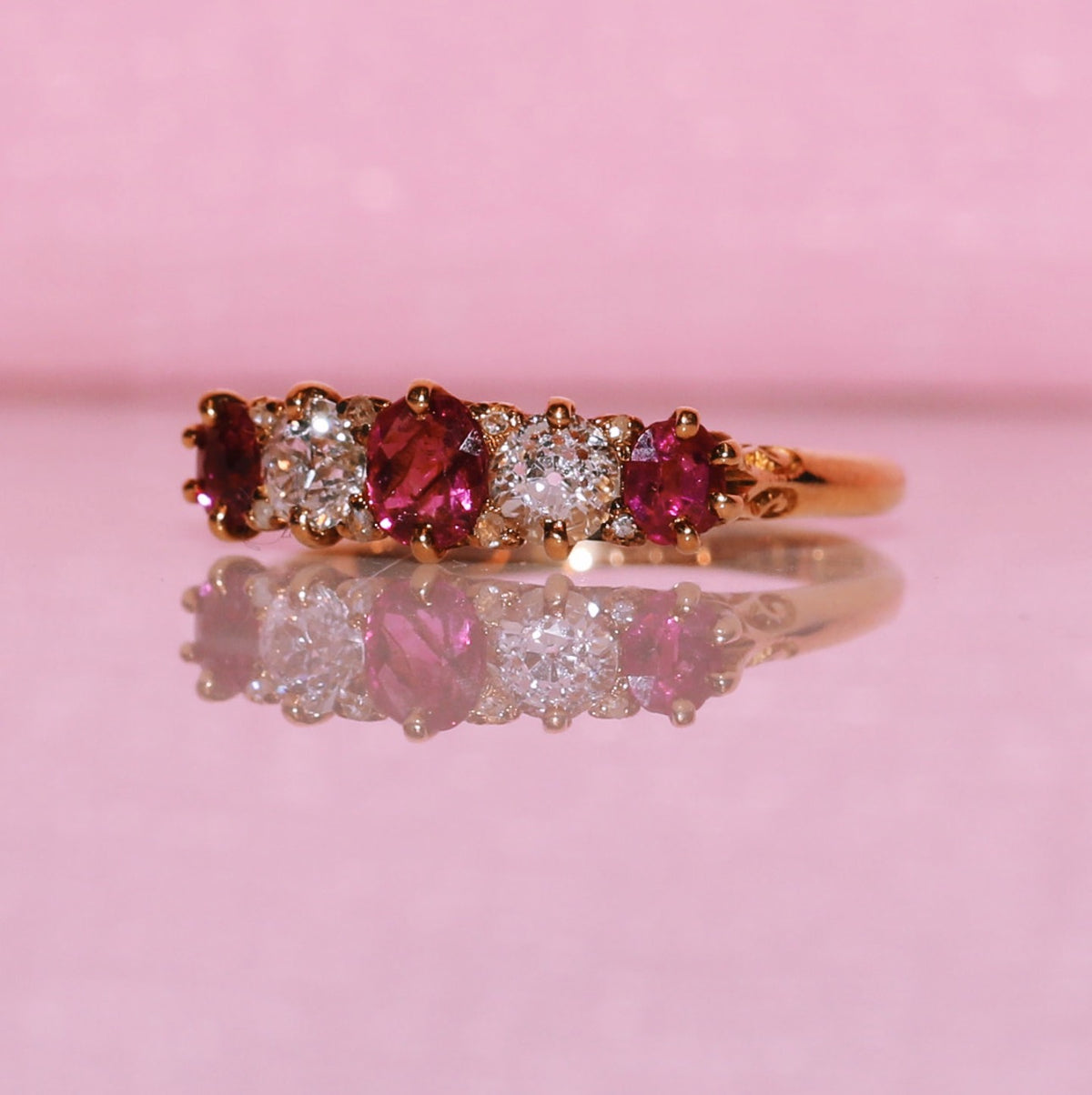 Vintage 18ct gold 0.70ct ruby and 0.40ct diamond half eternity ring