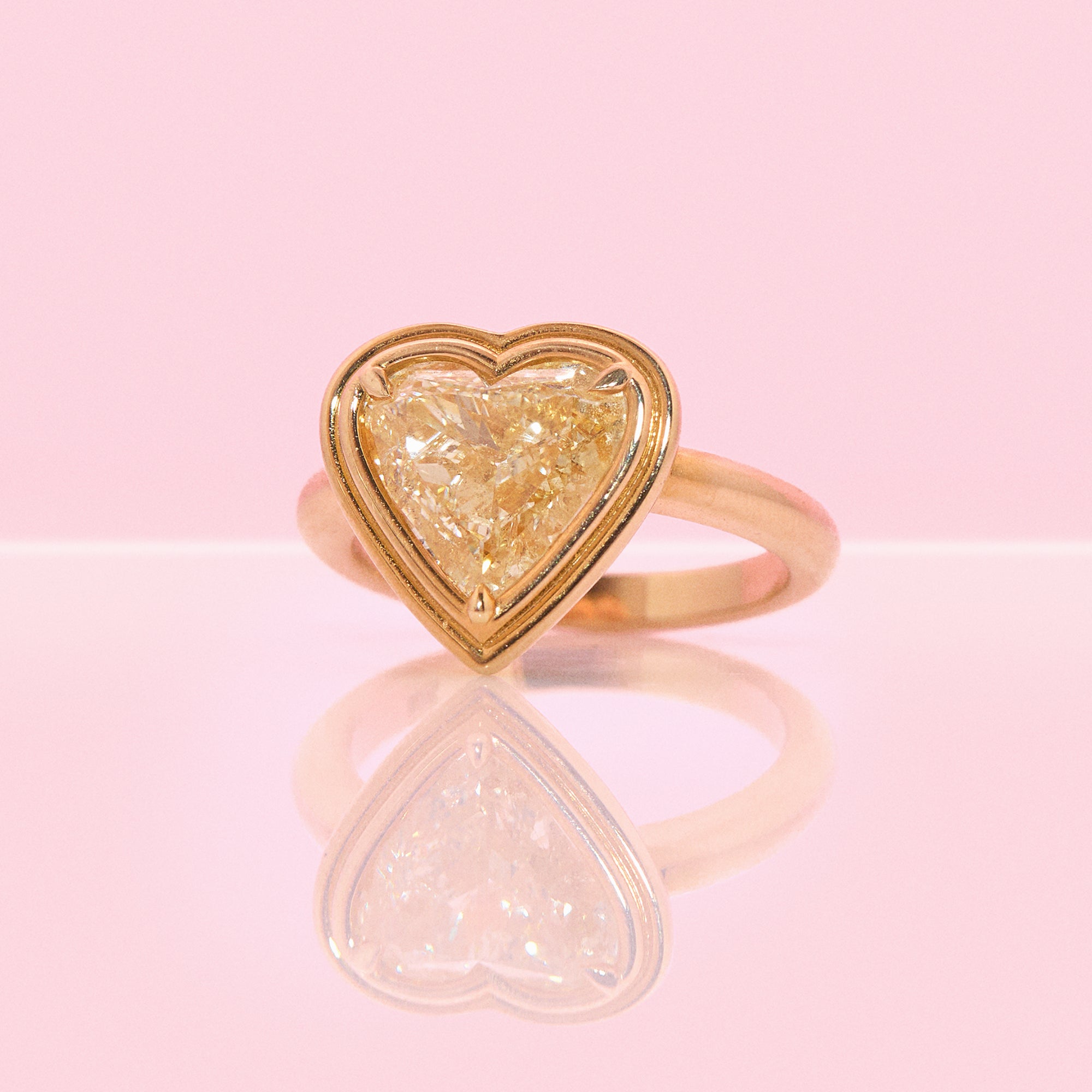 18ct gold bezel set fancy yellow 2.35ct heart-shaped diamond ring