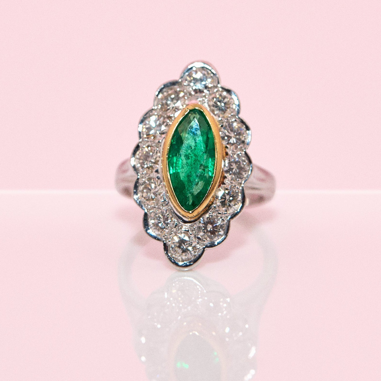 18ct white gold bezel set marquise emerald and diamond ring