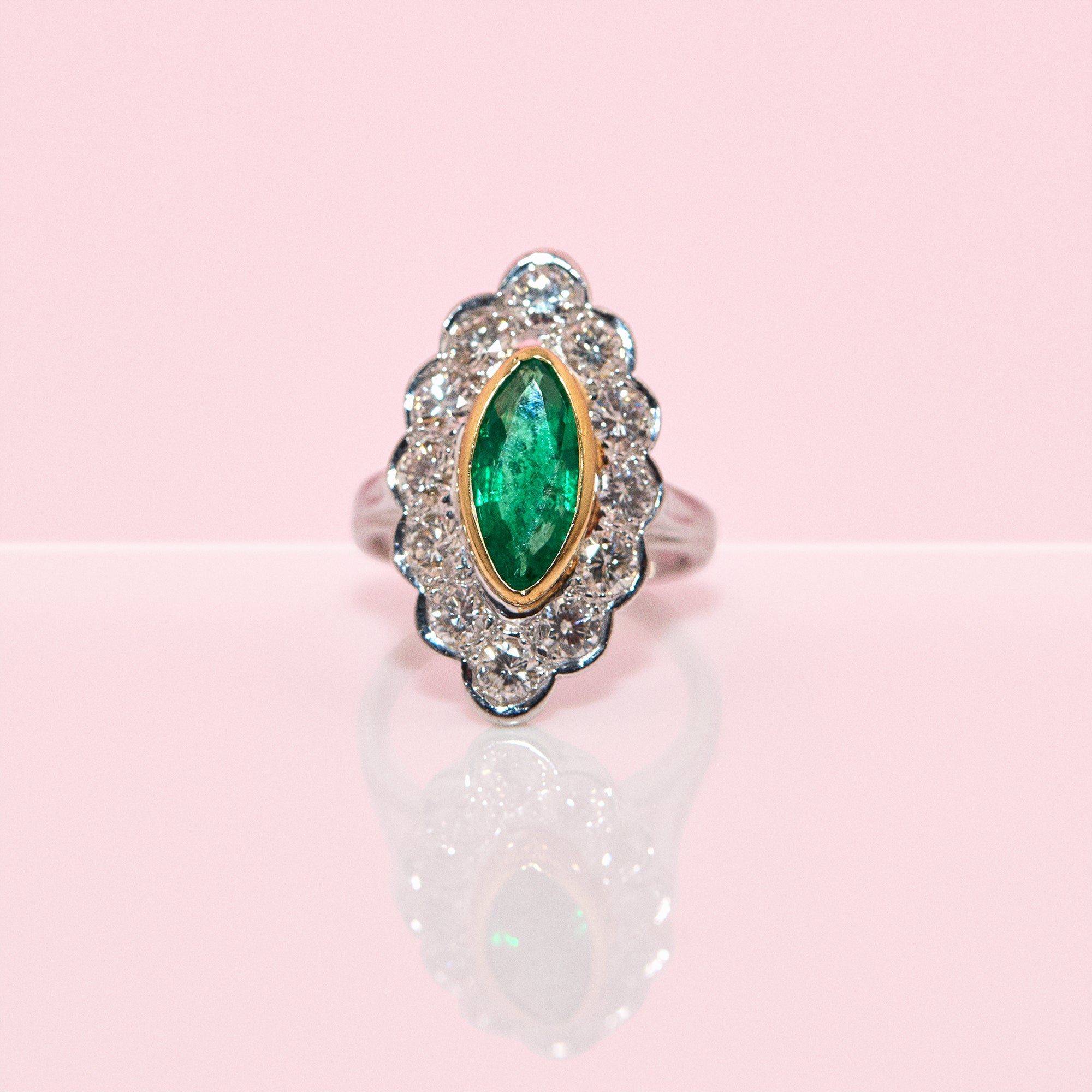 18ct white gold bezel set marquise emerald and diamond ring