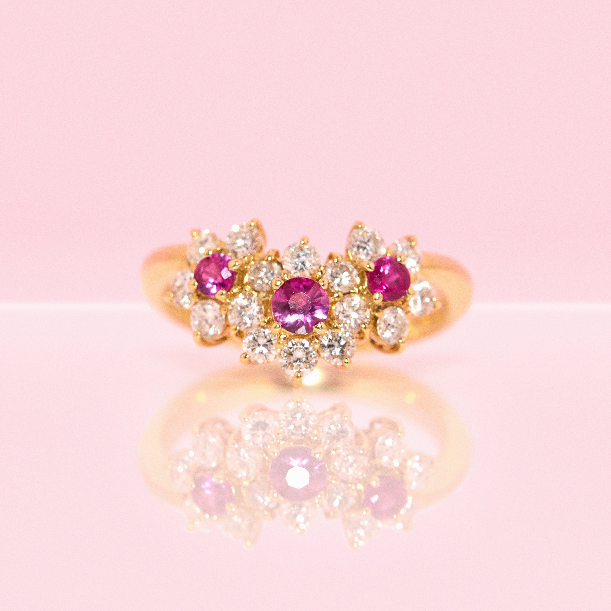 18ct gold ruby and diamond flower ring