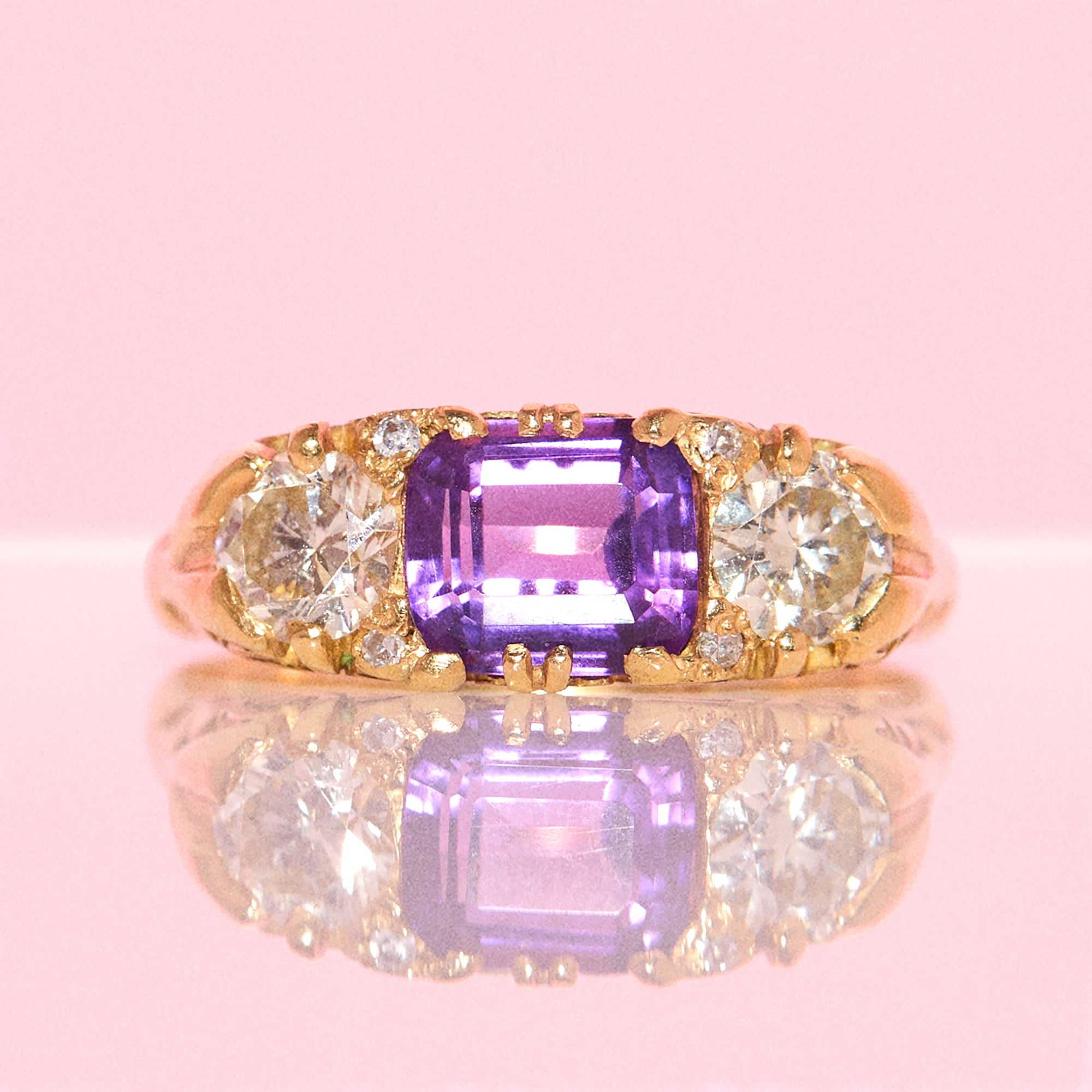 Vintage 18ct gold east to west amethyst and diamond carved ring