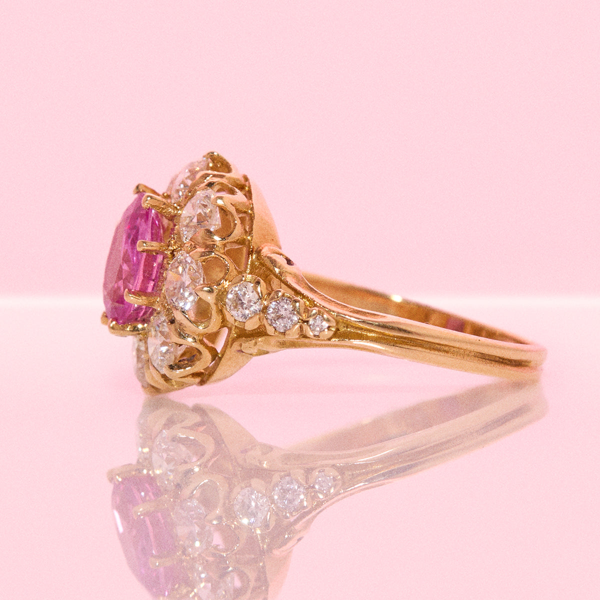 Vintage 18ct gold 1.16ct oval pink sapphire and 1.0ct diamond cluster ring