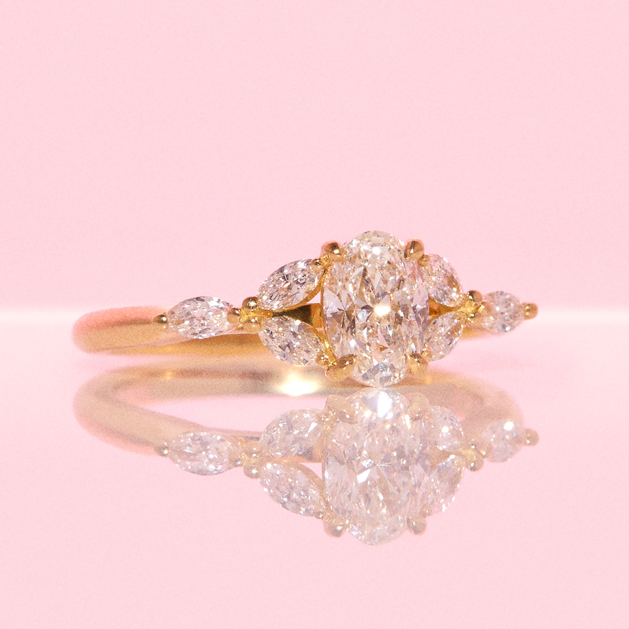 18ct gold 0.70ct oval diamond cluster ring (made to order)