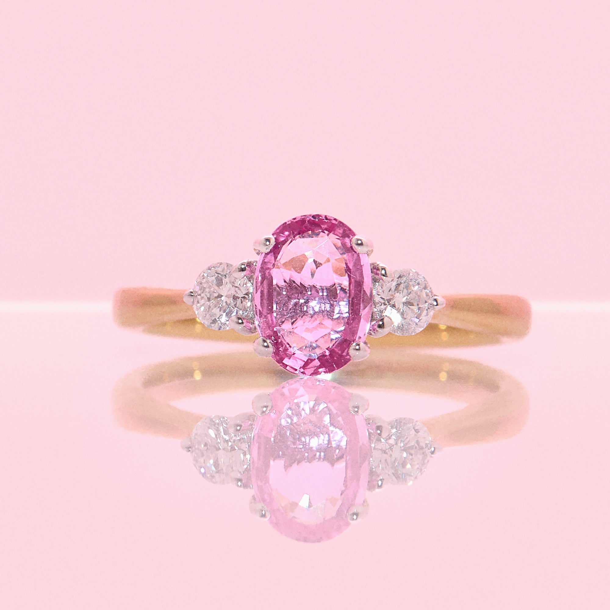 18ct gold 1.22ct pink sapphire and 0.25ct diamond three stone ring