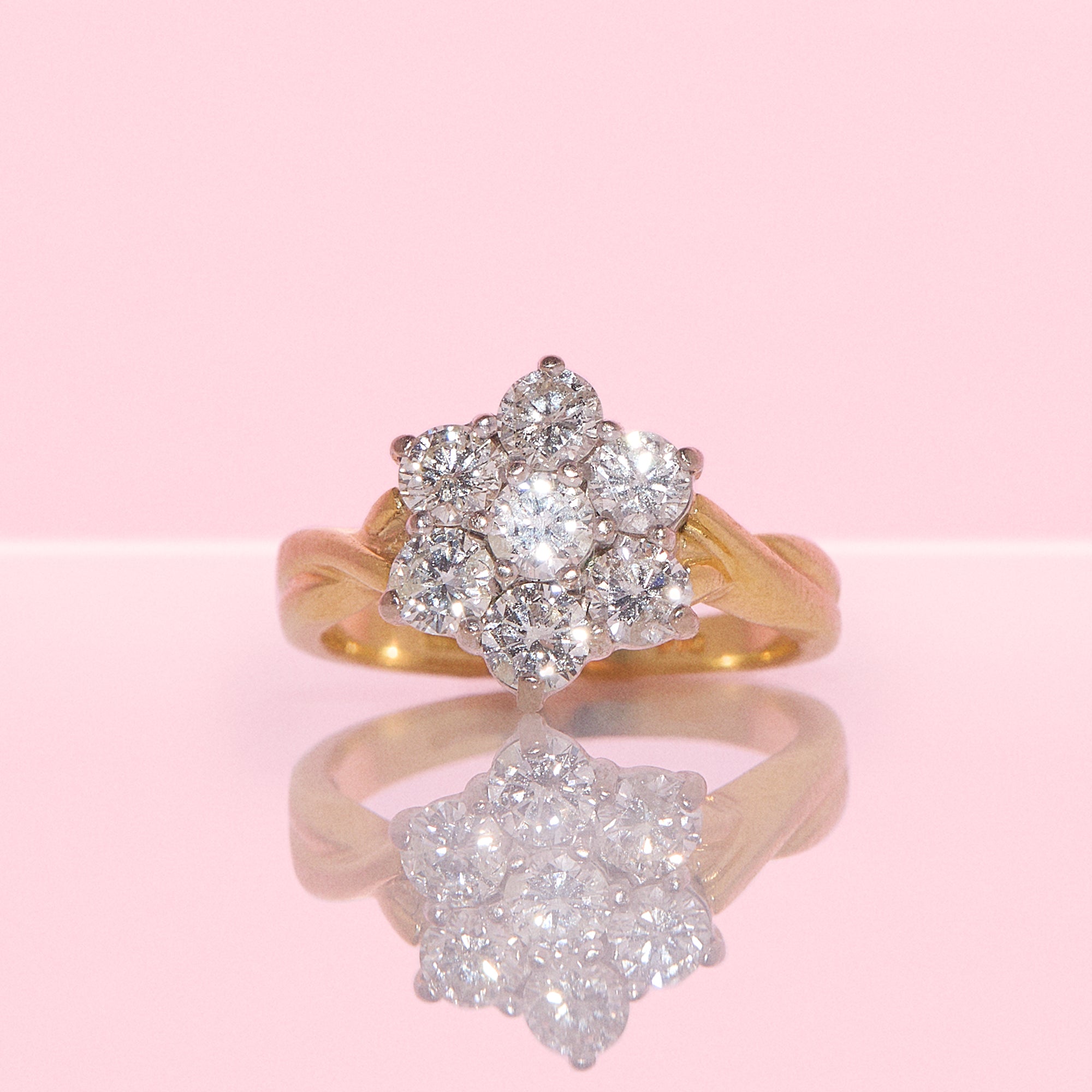 18ct gold diamond flower ring with a twisted band