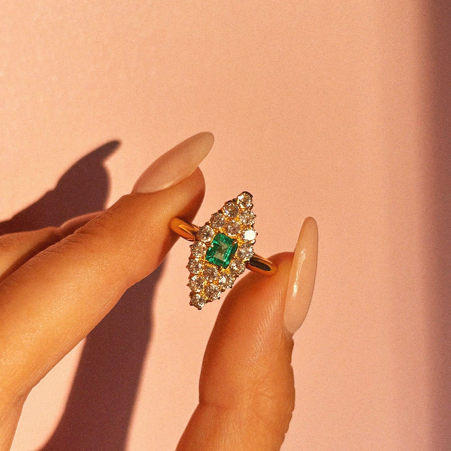 18ct gold ring set with an emerald and diamonds