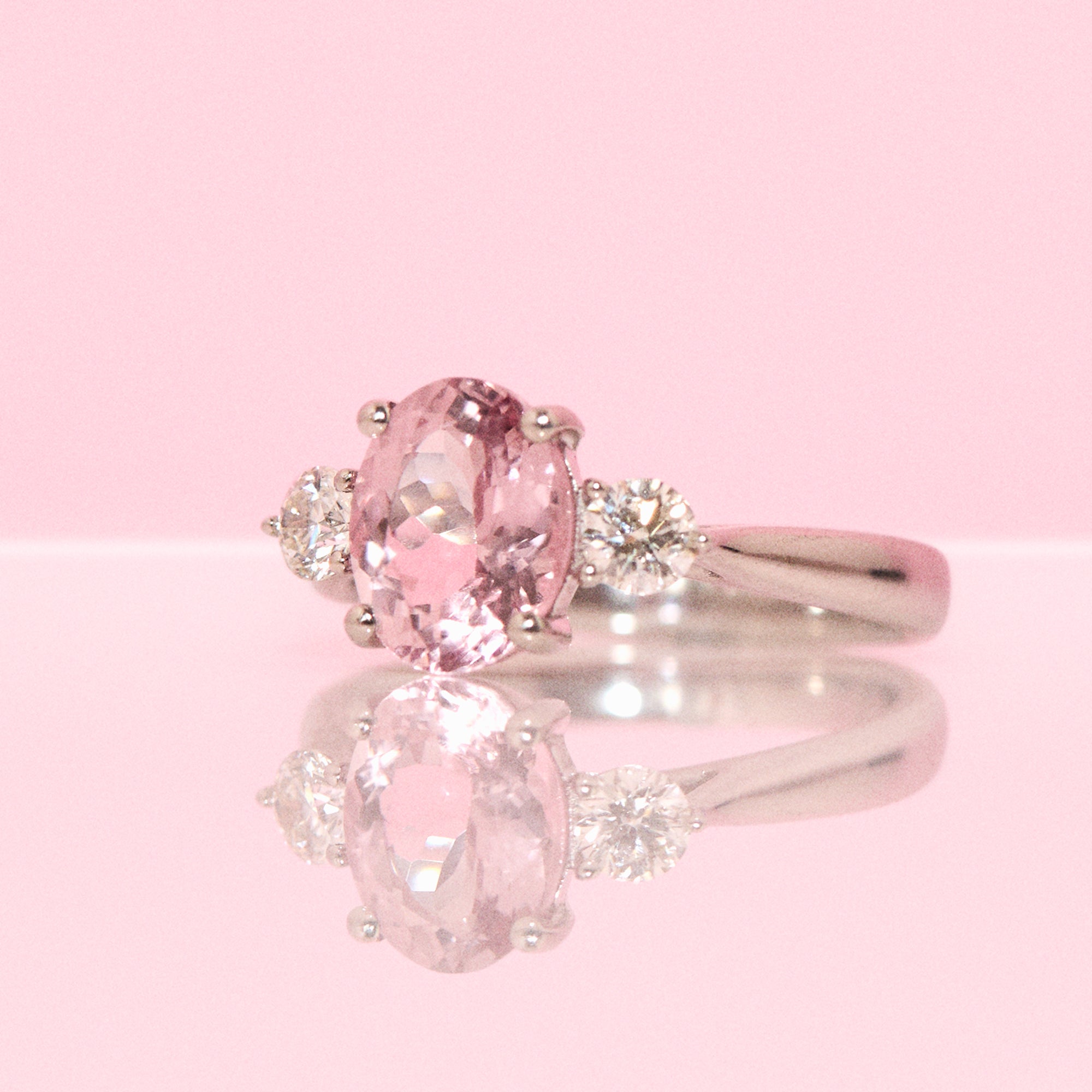 Platinum morganite and diamond three stone ring