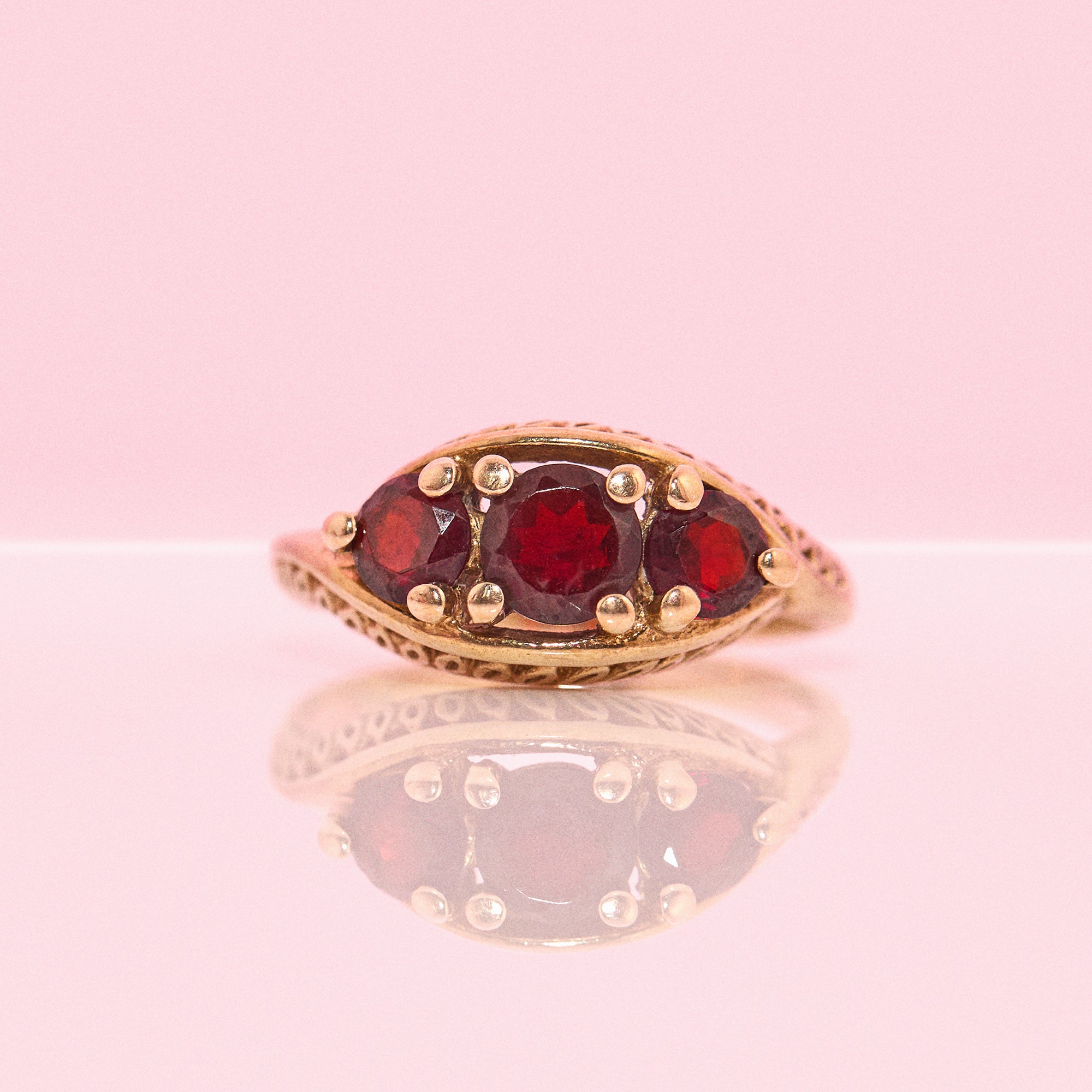 9ct gold three stone garnet ring