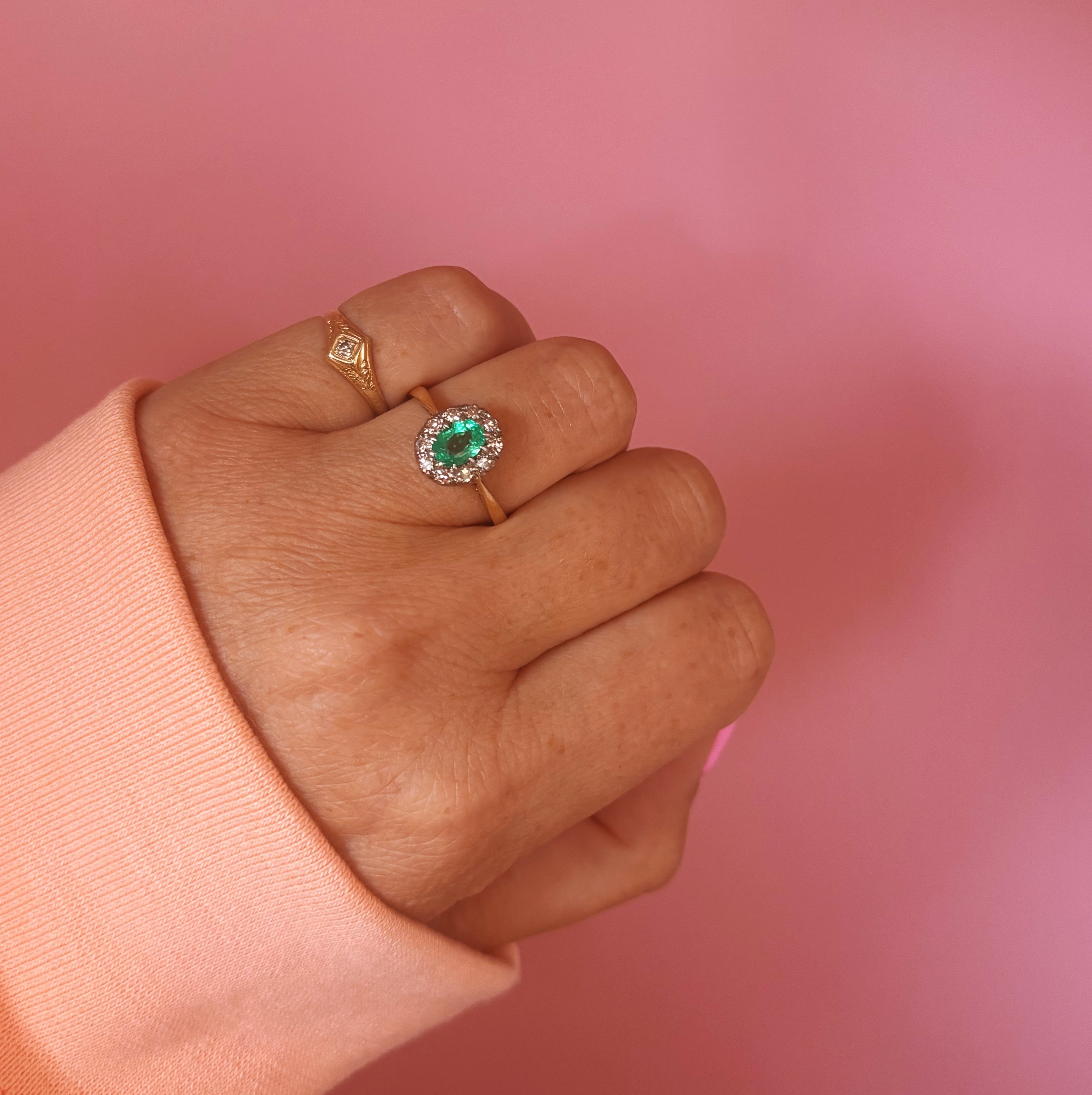 18ct gold oval emerald and diamond cluster ring