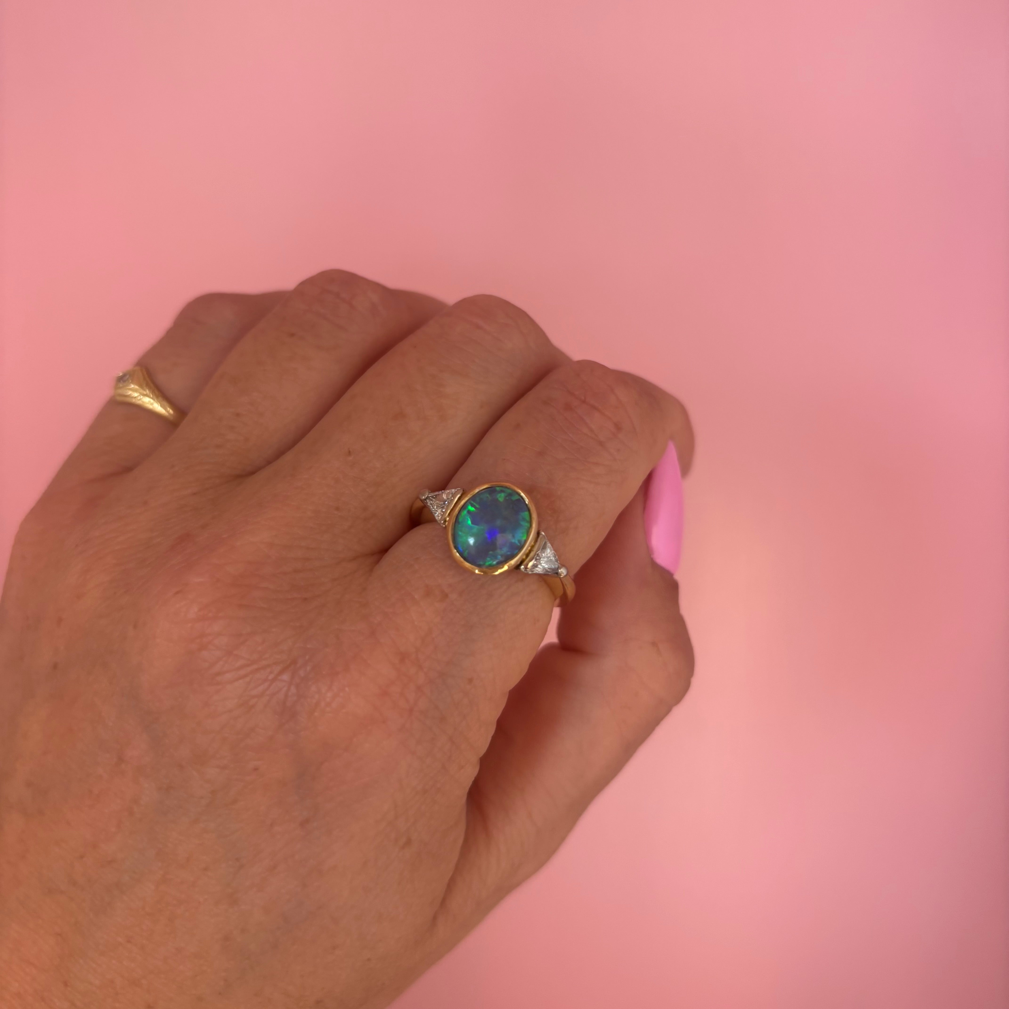 18ct gold bezel set black opal and diamond ring