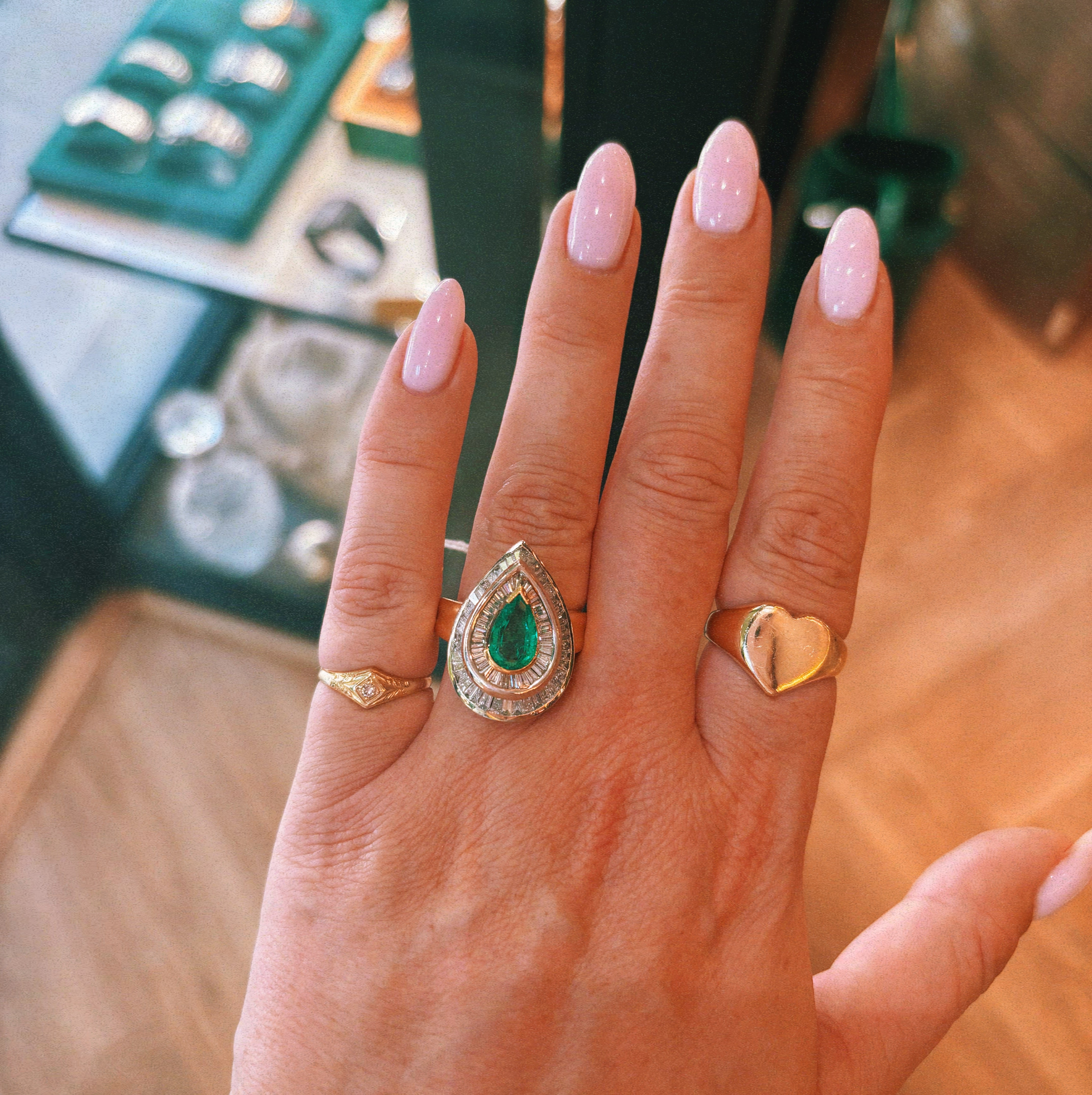 18ct gold emerald and baguette diamond cluster ring