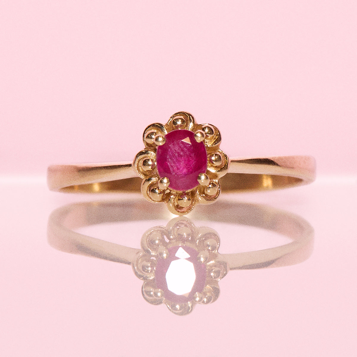 Vintage 18ct gold 0.60ct ruby and diamond flower ring