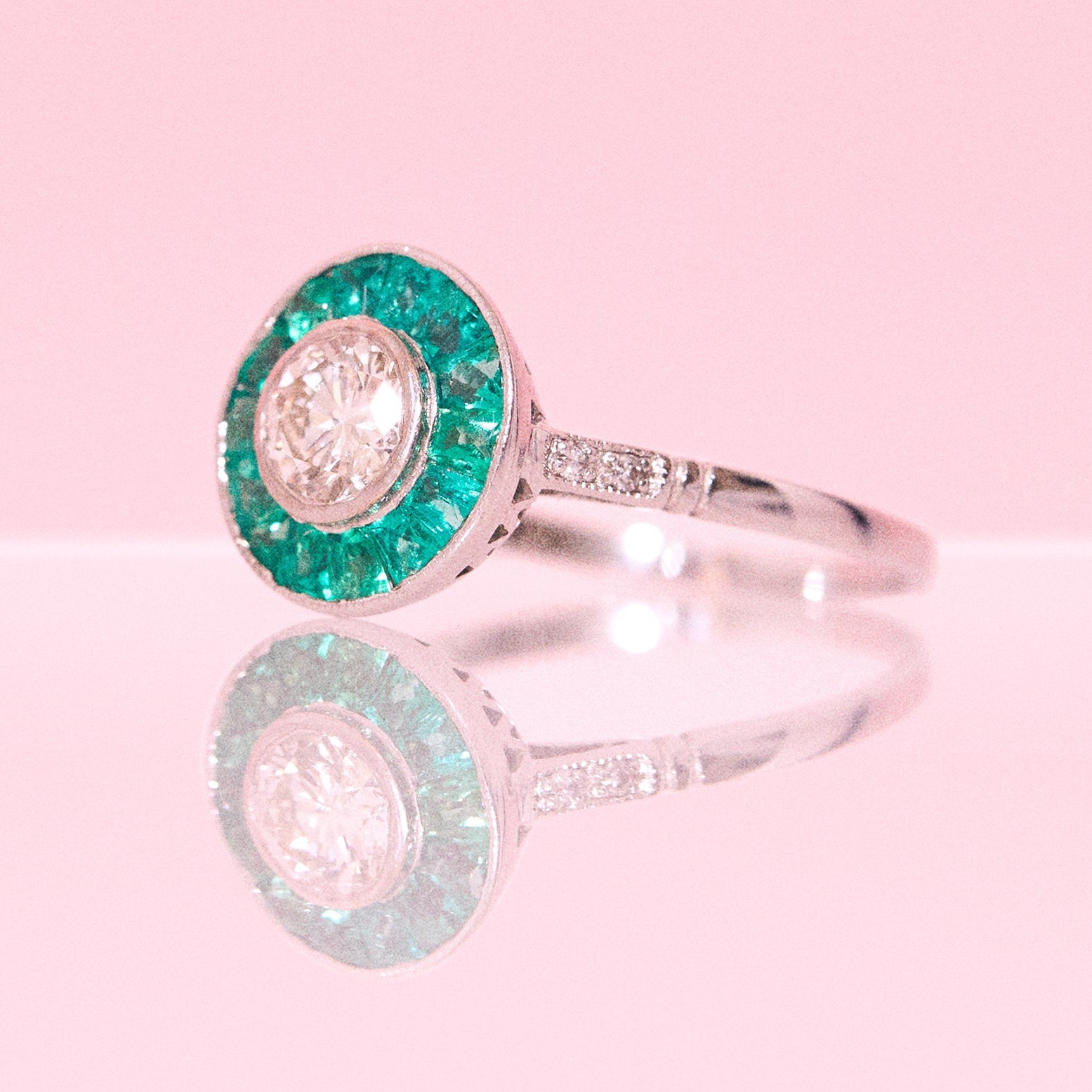 Platinum 1.10ct diamond and emerald ring