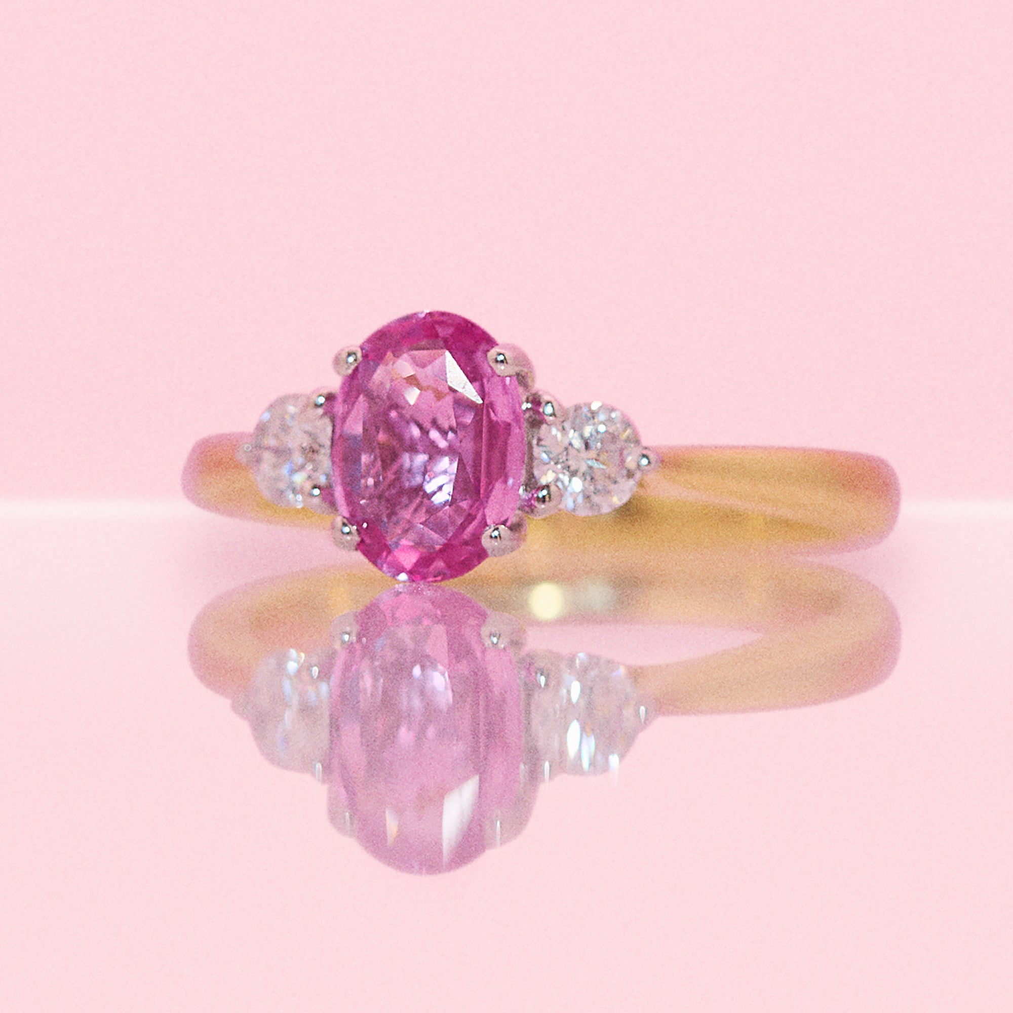 18ct gold 1.22ct pink sapphire and 0.25ct diamond three stone ring