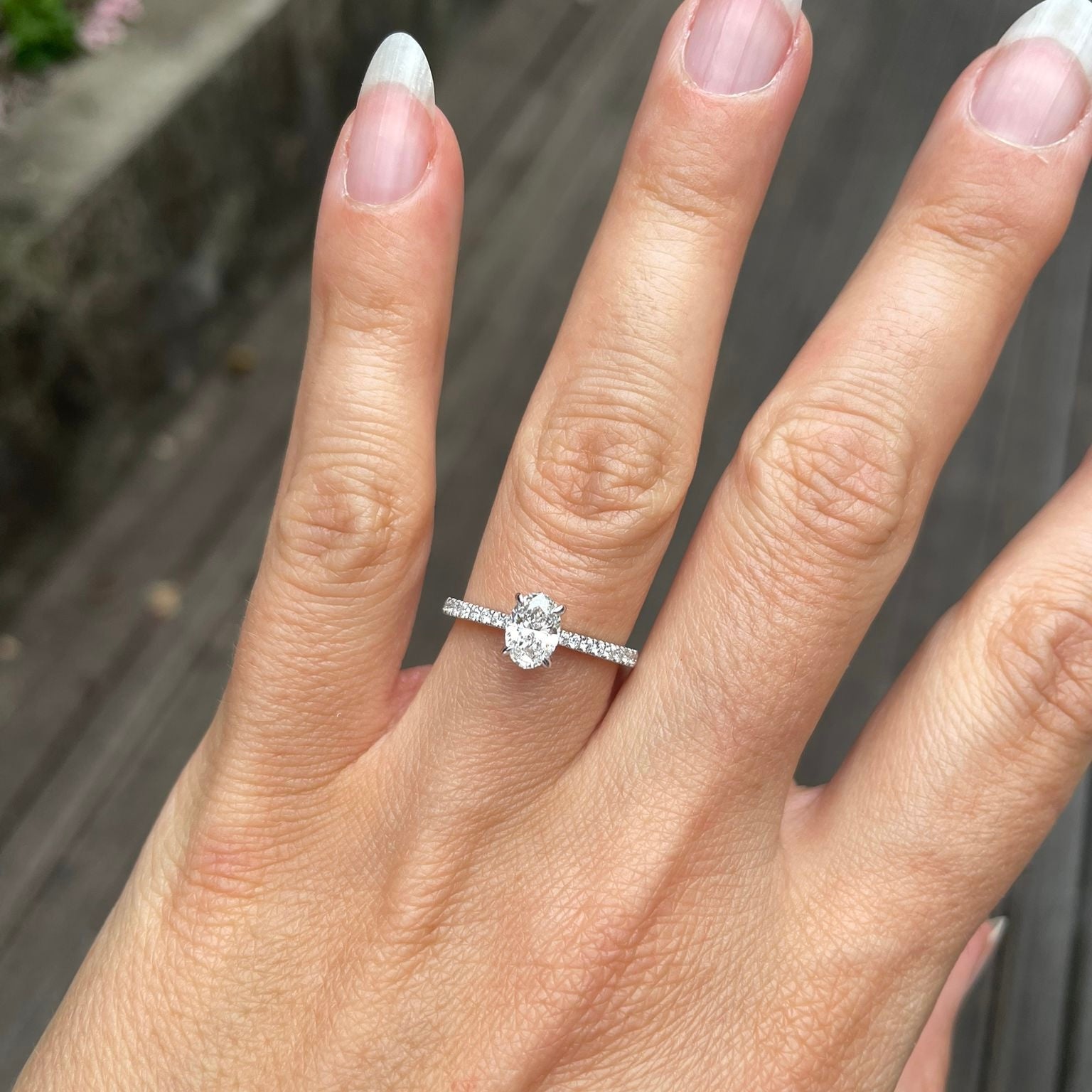 18ct gold 0.70ct oval diamond cluster ring