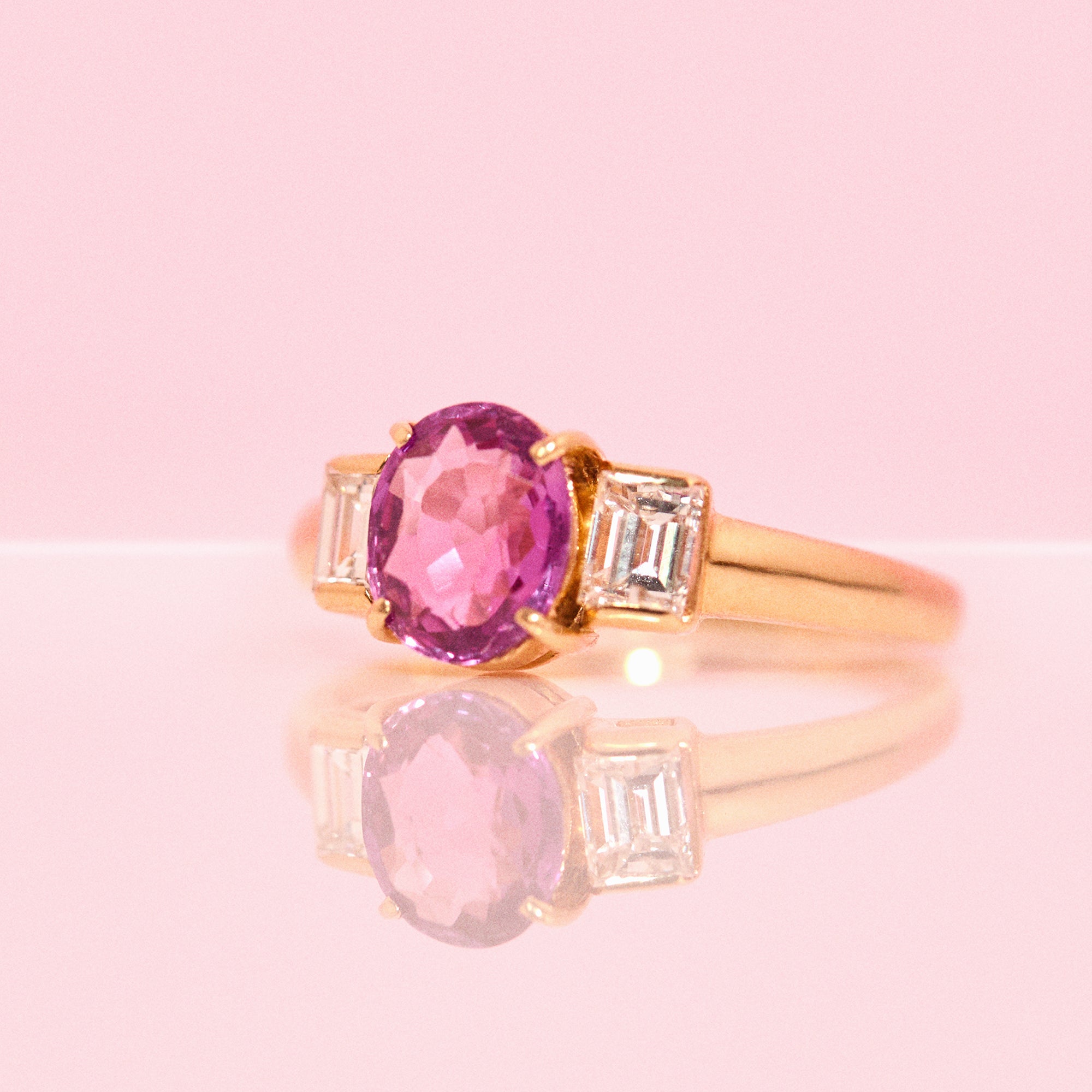 18ct gold pink sapphire and diamond three stone ring