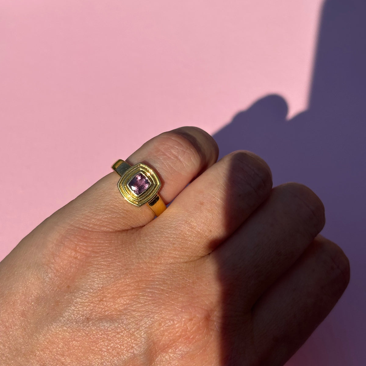 14ct gold plum mauve sapphire bezel set ring