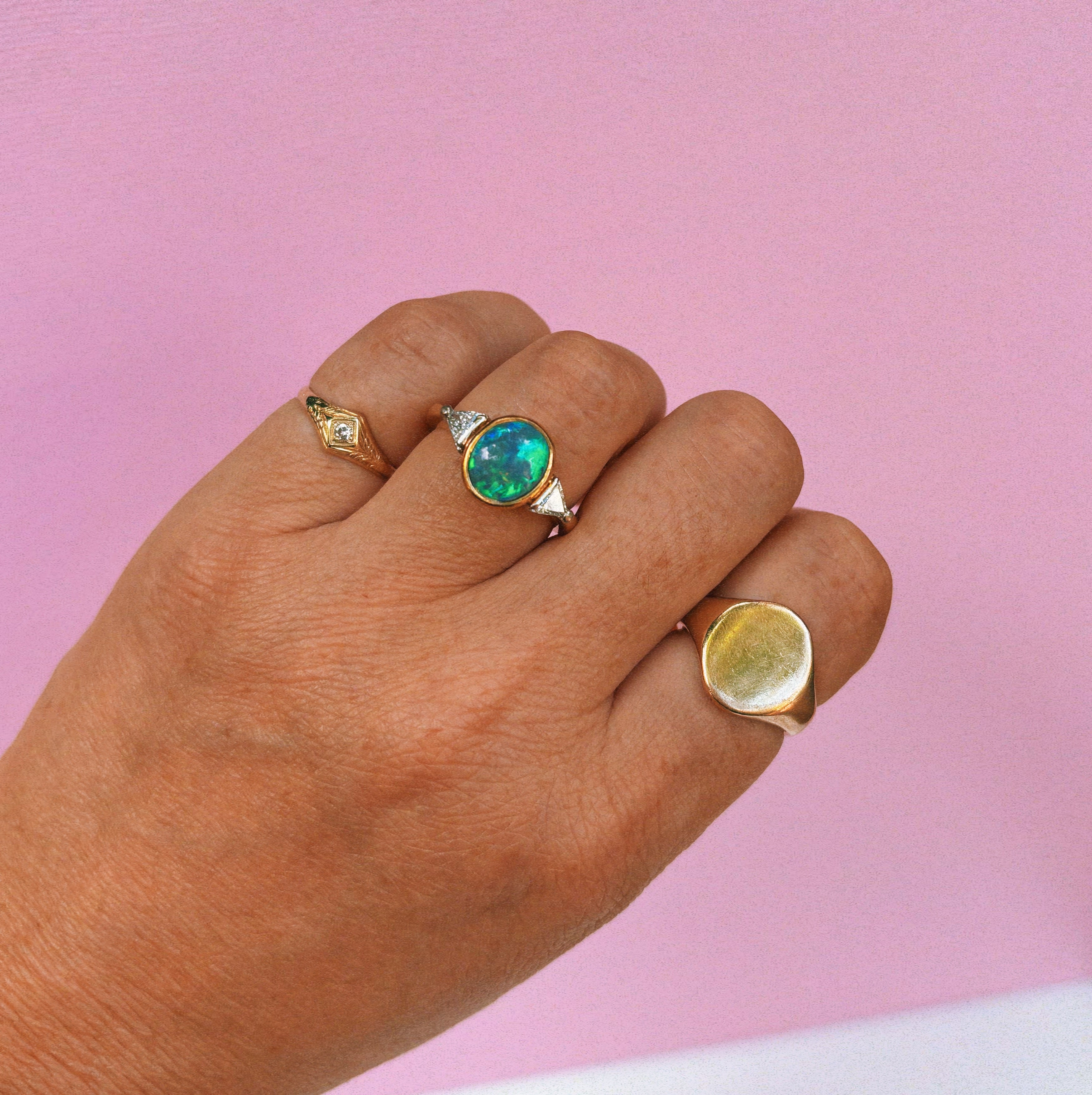 18ct gold bezel set black opal and diamond ring