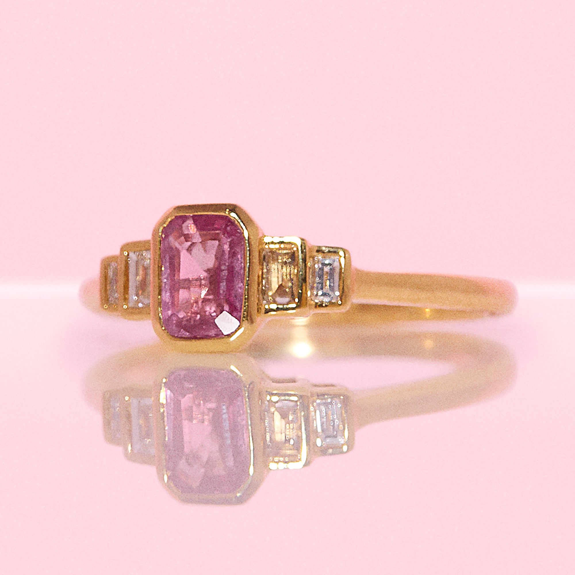 18ct gold 0.72ct emerald cut pink sapphire and 0.13ct diamond ring