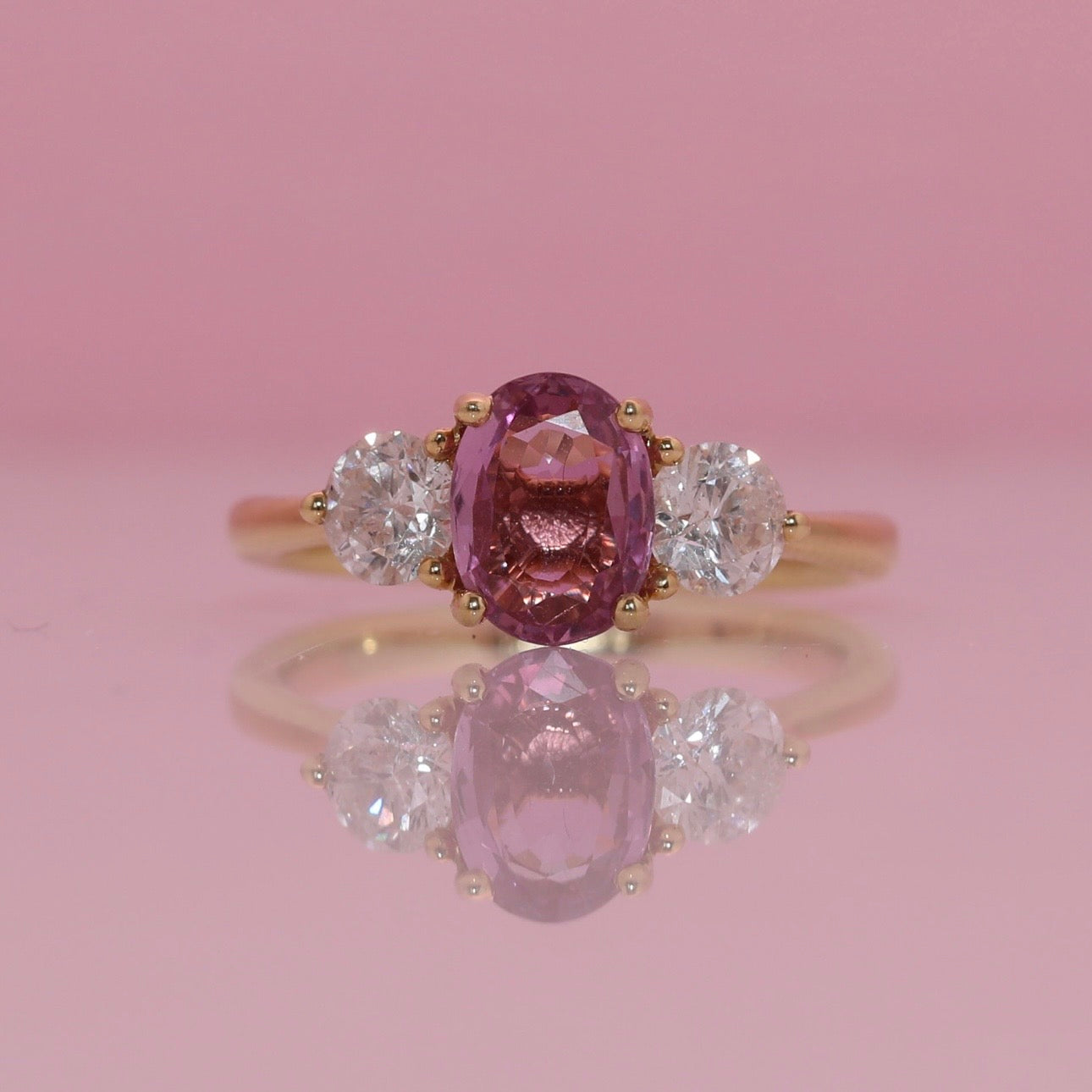 18ct gold 1.46ct pink sapphire and 0.84ct diamond three stone ring