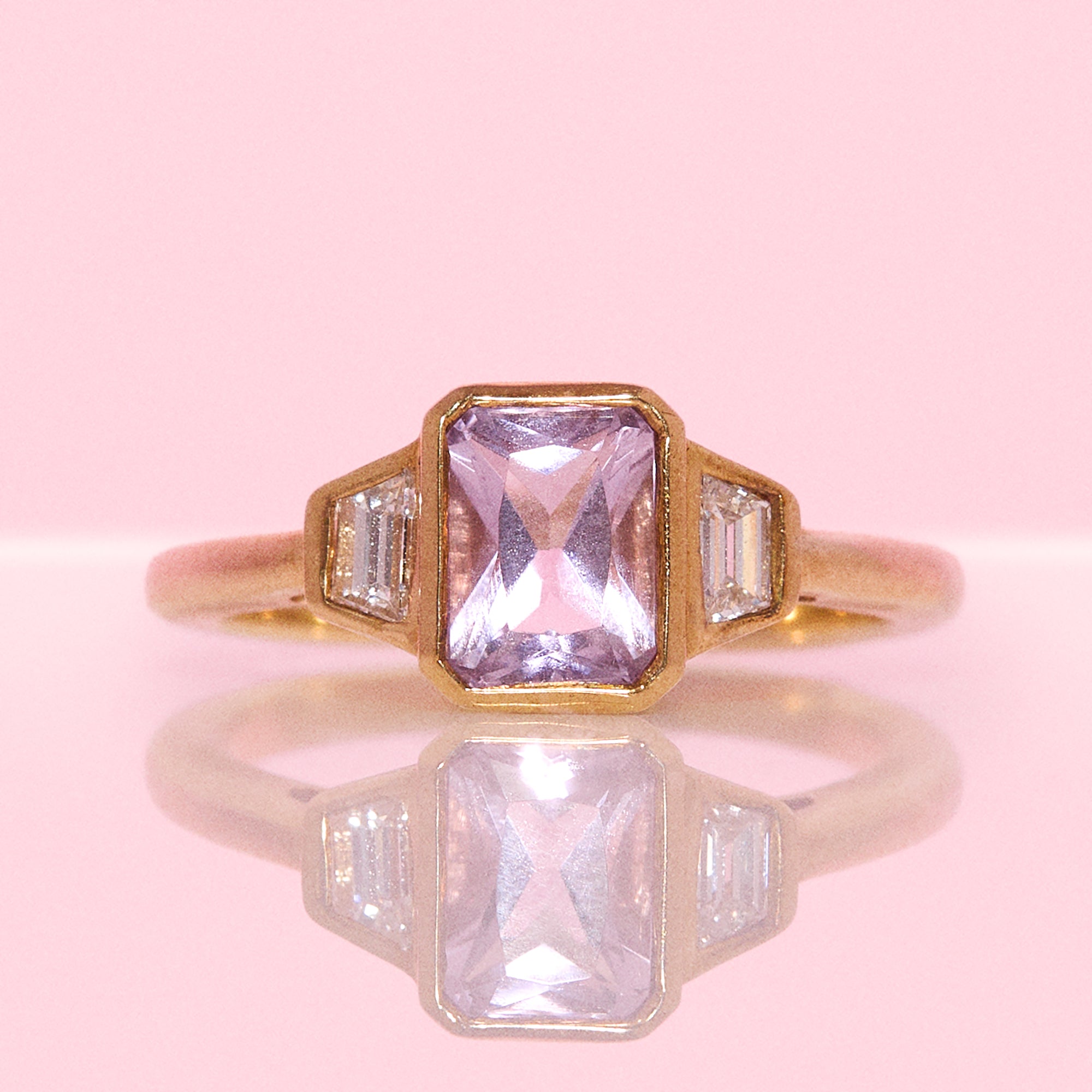 9ct gold 0.94ct emerald cut amethyst and 0.17ct diamond ring