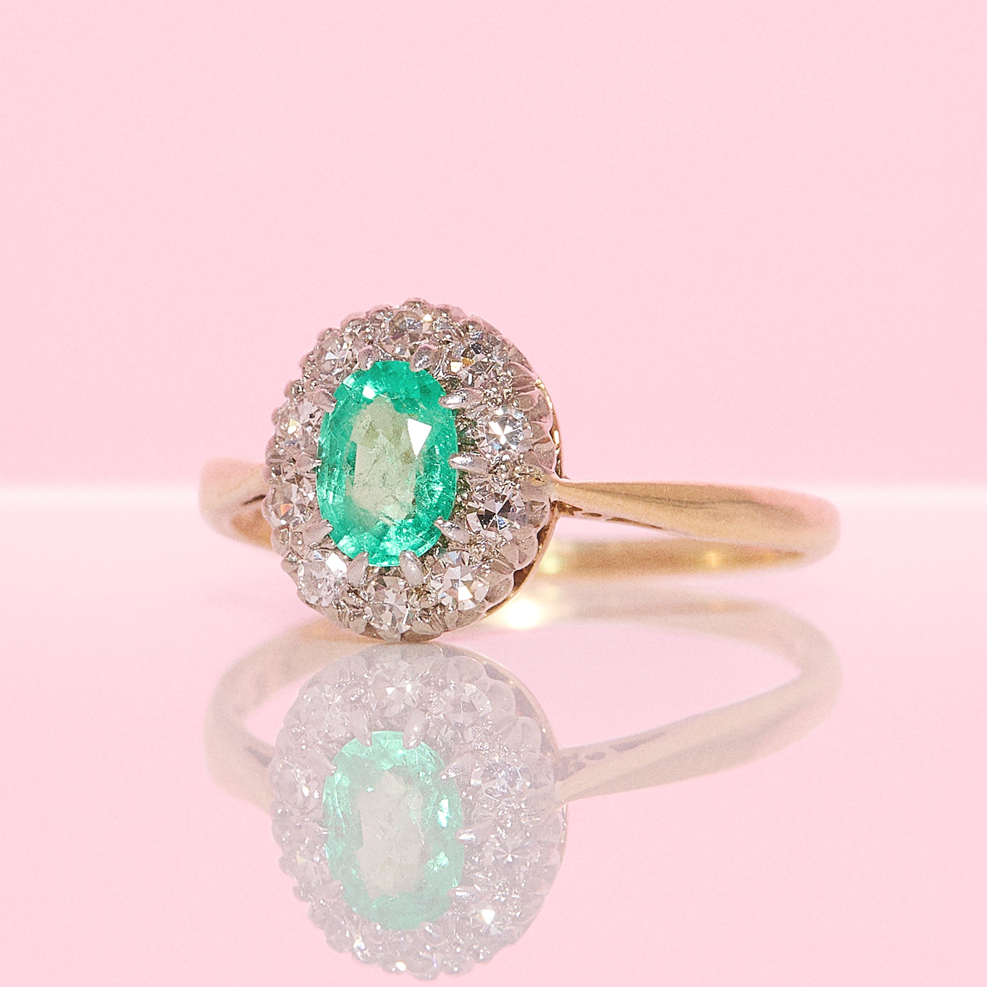 18ct gold oval emerald and diamond cluster ring