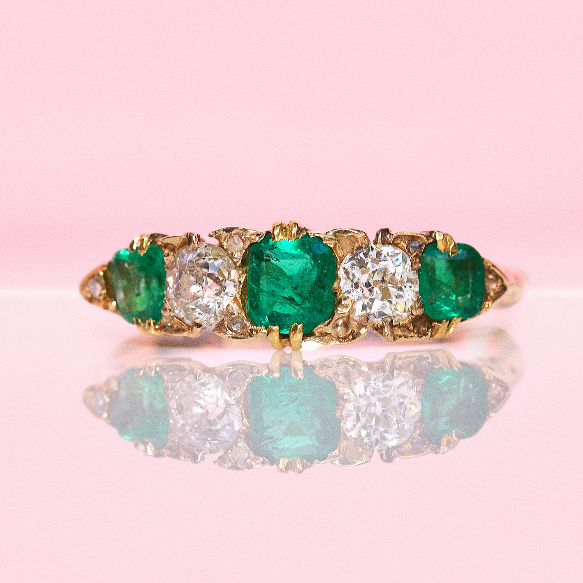 18ct gold emerald and diamond five stone carved ring