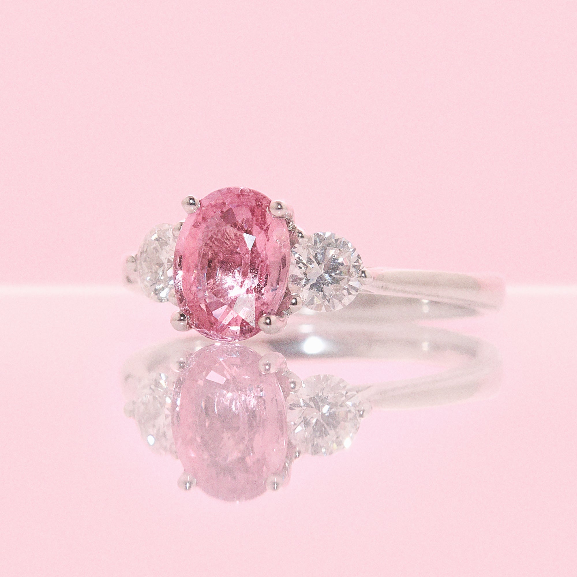 Platinum 1.24ct pink sapphire and 0.43ct diamond three stone ring (made to order)