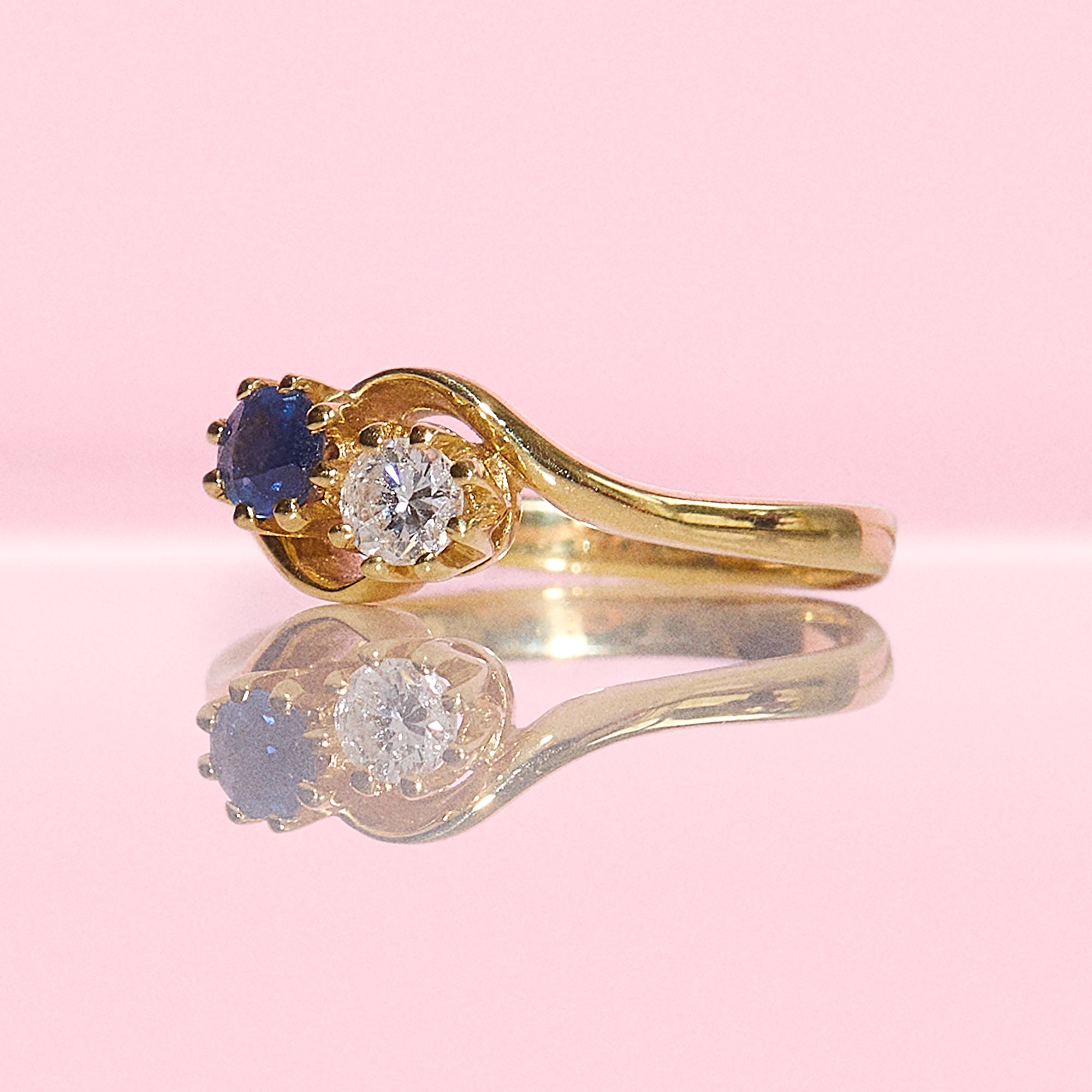 18ct gold Diamond and Sapphire cross over ring