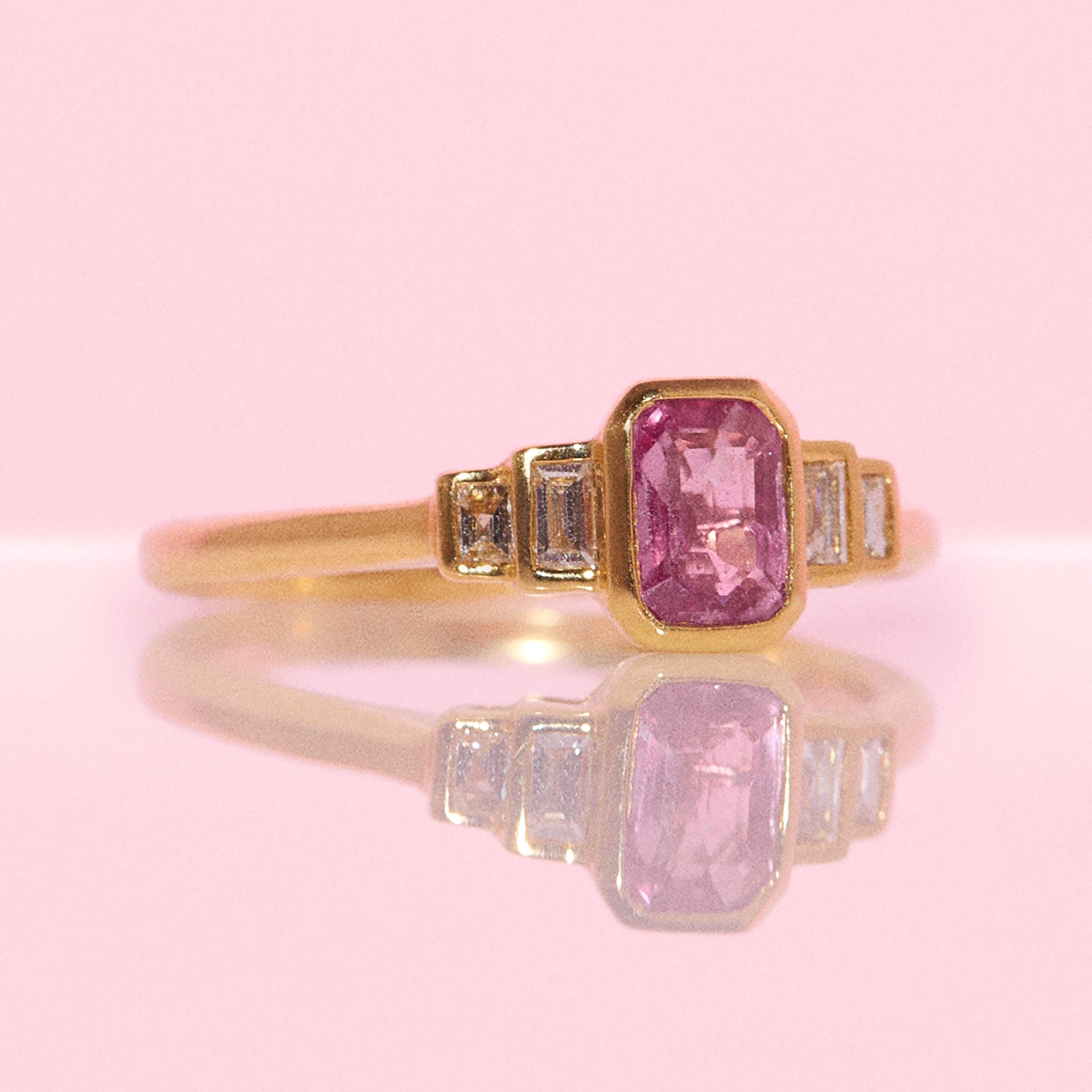 18ct gold 0.72ct emerald cut pink sapphire and 0.13ct diamond ring