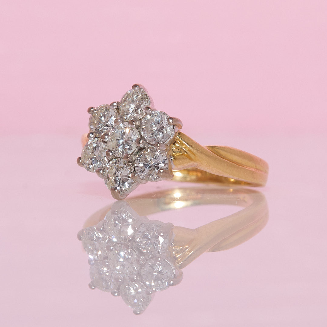 18ct gold diamond flower ring with a twisted band