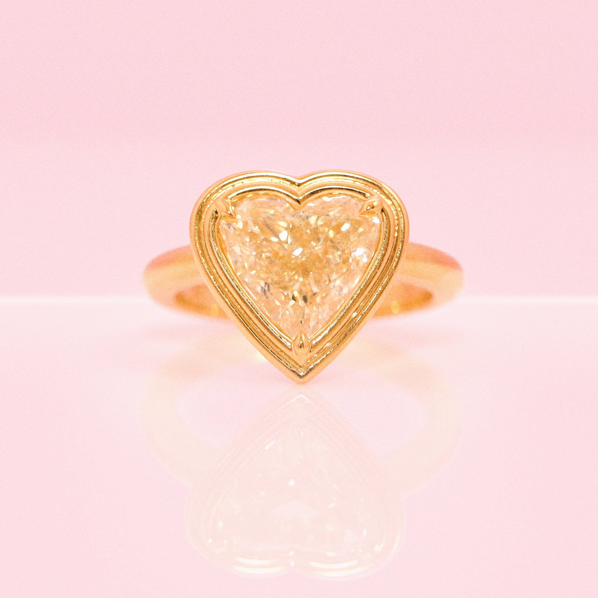 18ct gold bezel set fancy yellow 2.35ct heart-shaped diamond ring