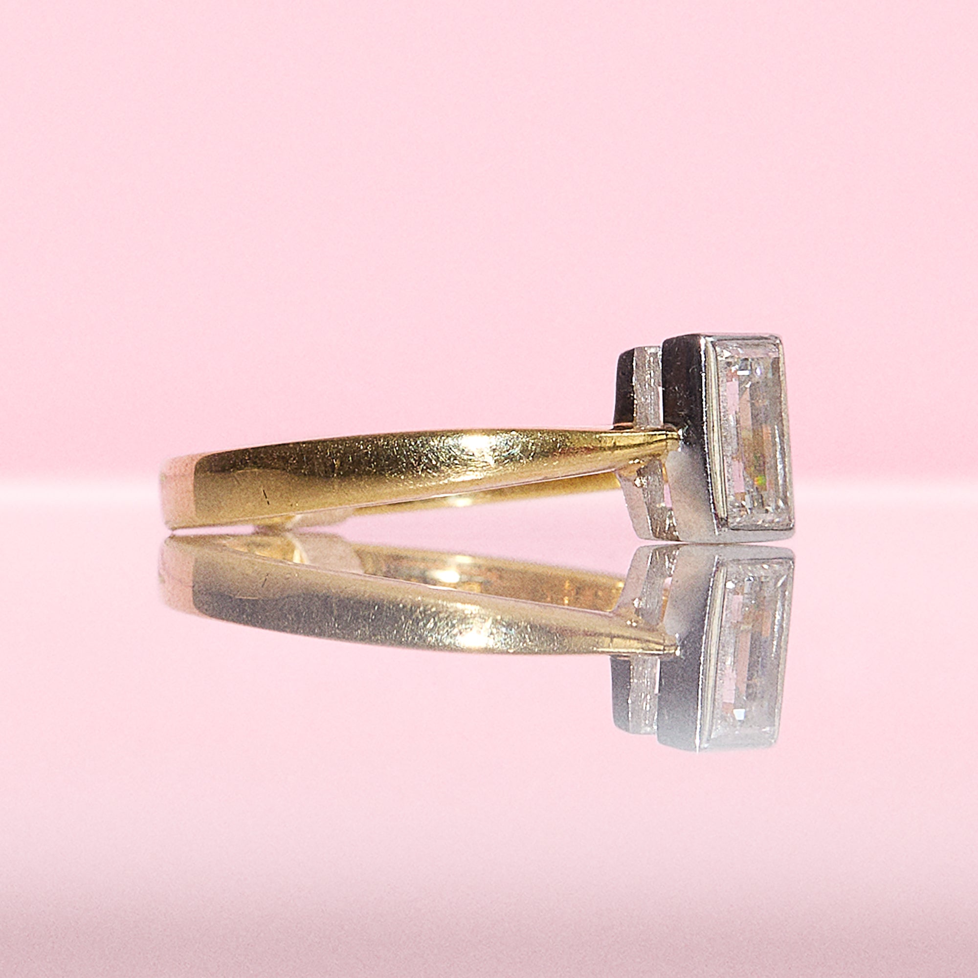 18ct gold 0.71ct emerald cut bezel set diamond ring