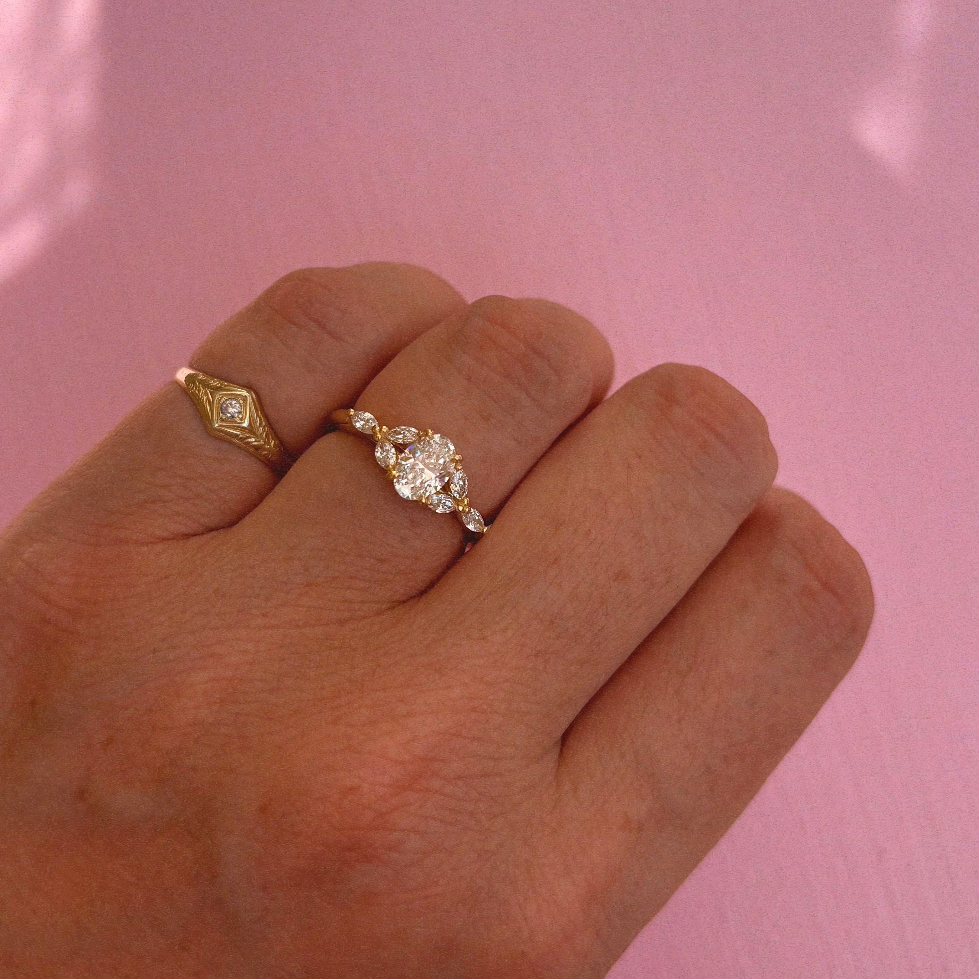 18ct gold 0.70ct oval diamond cluster ring (made to order)