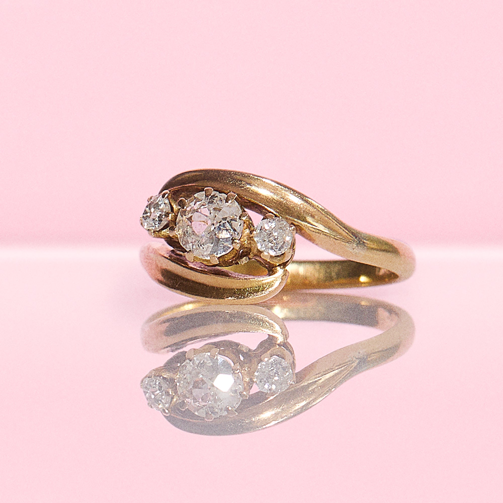 18ct gold old cut diamond three stone cross over ring