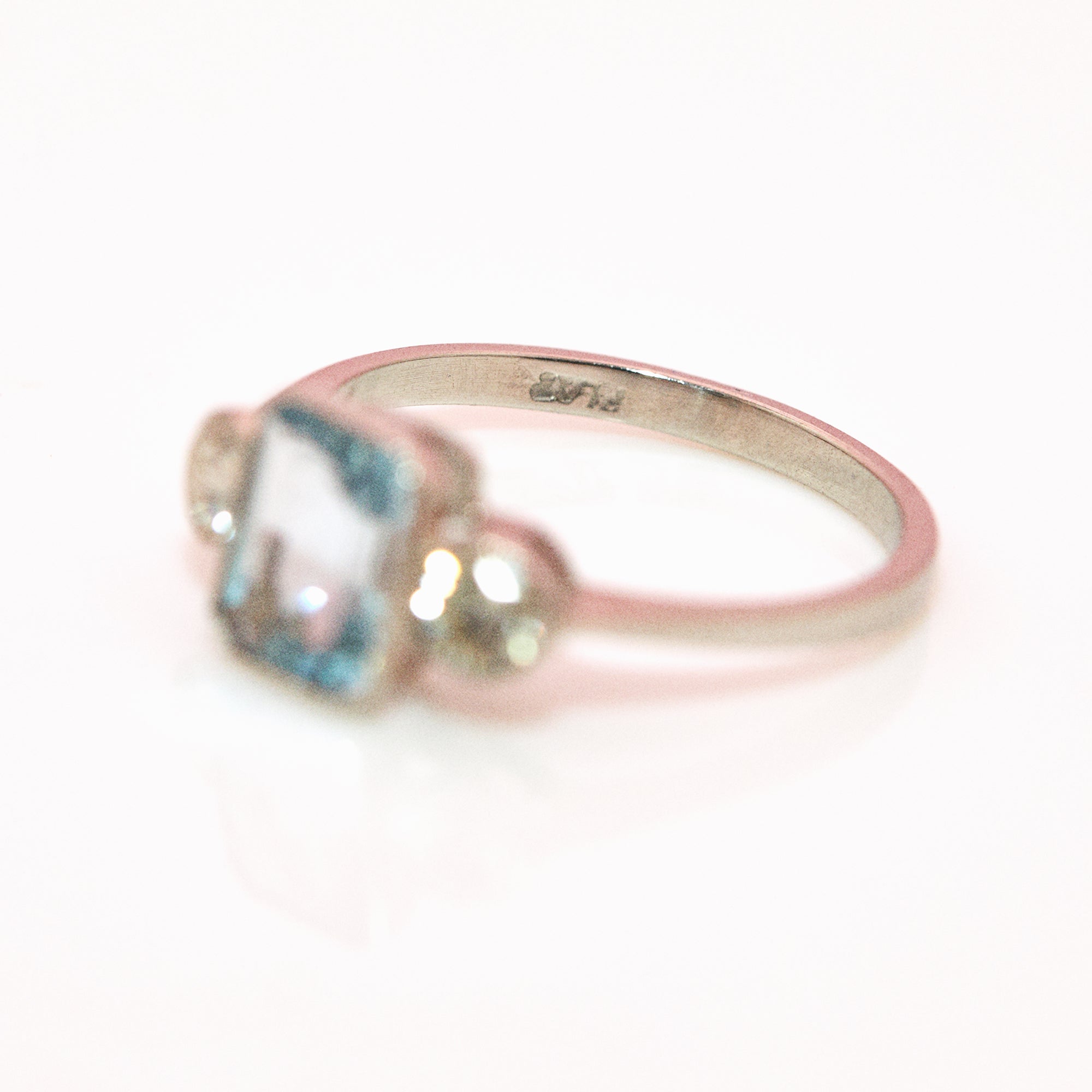 Platinum aquamarine and diamond three stone ring