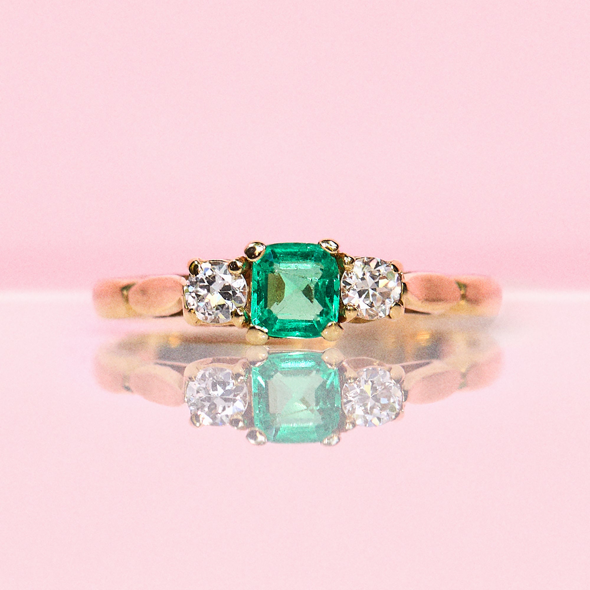 18ct gold emerald cut emerald and diamond three stone ring