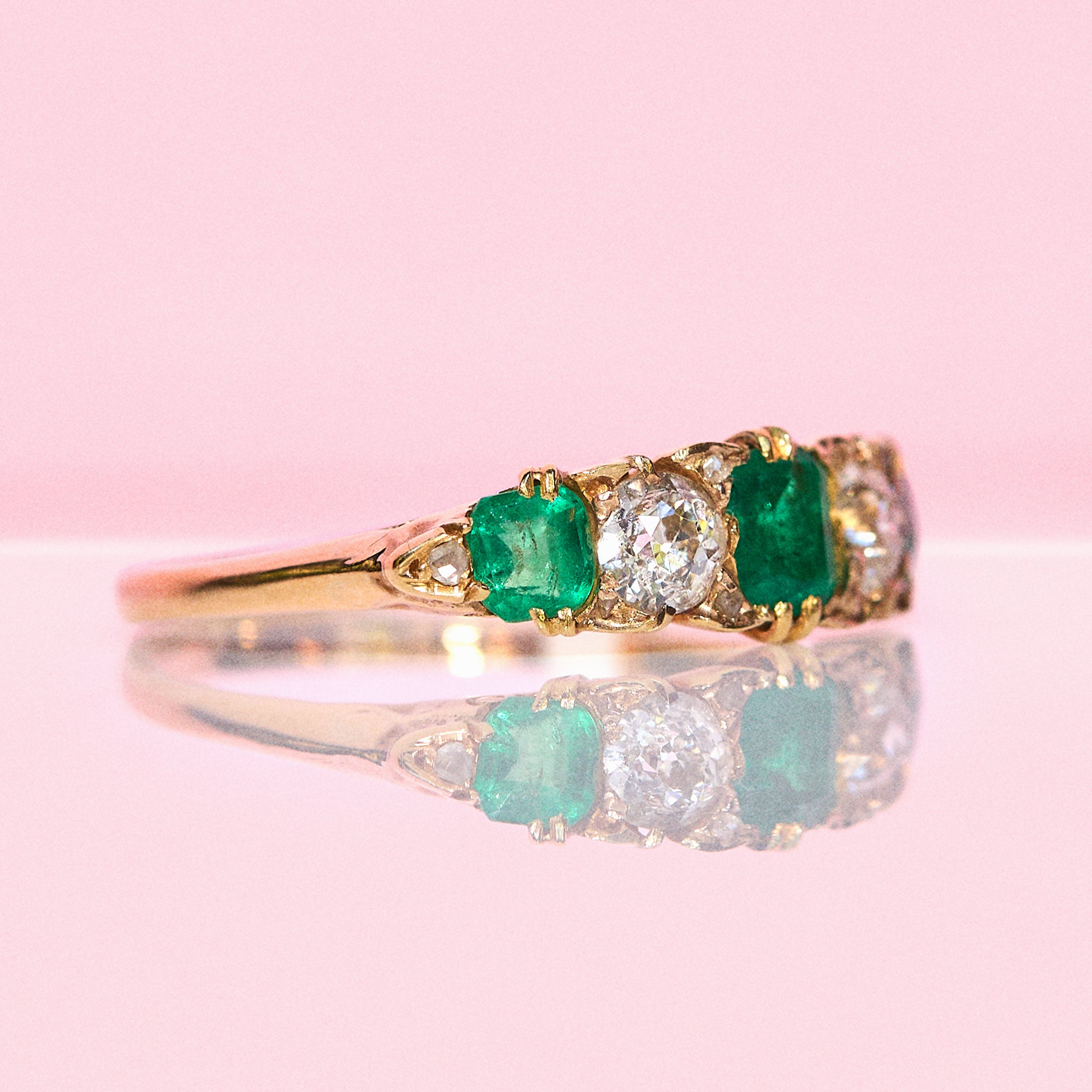 18ct gold emerald and diamond five stone carved ring