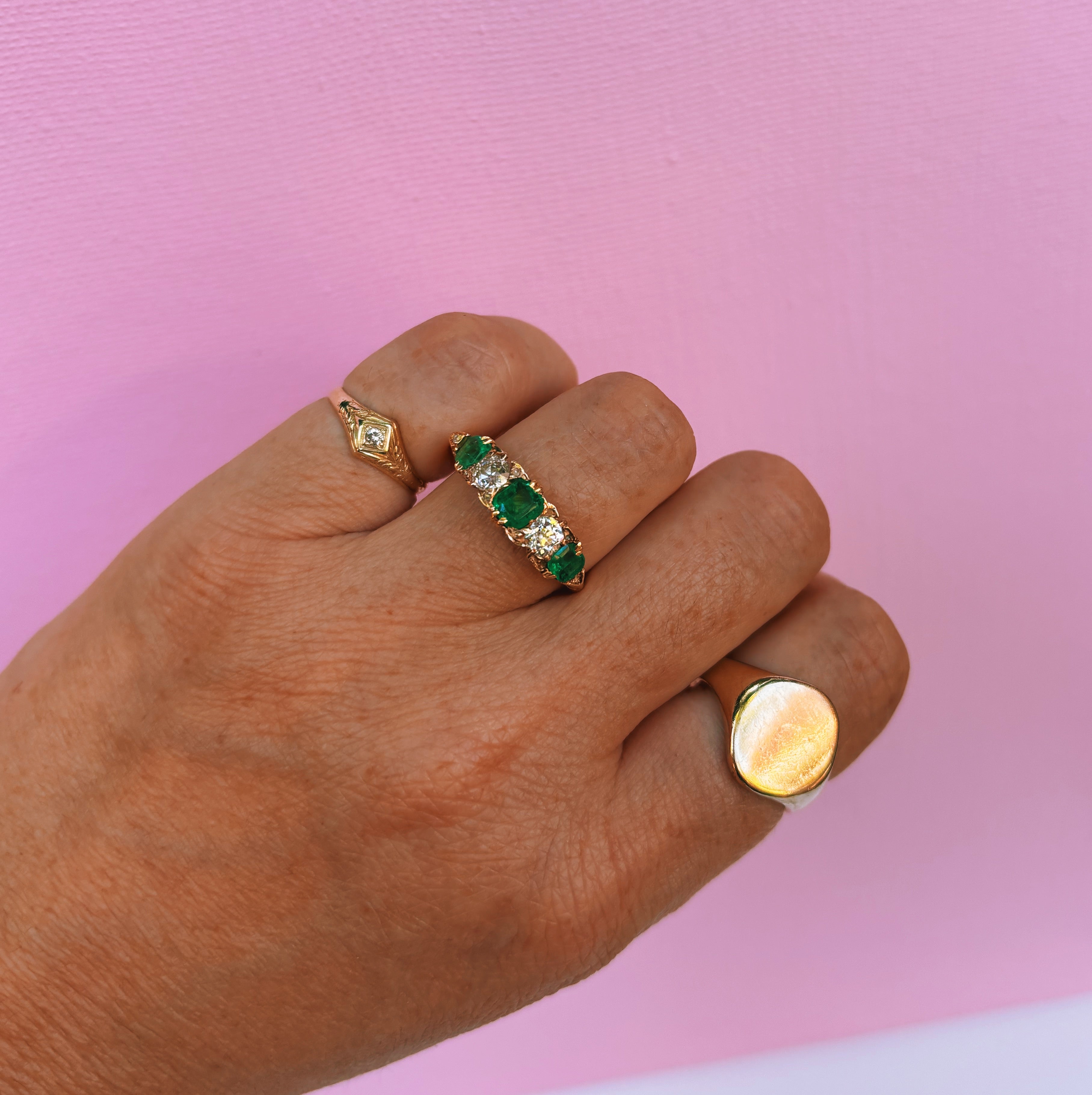 18ct gold emerald and diamond five stone carved ring