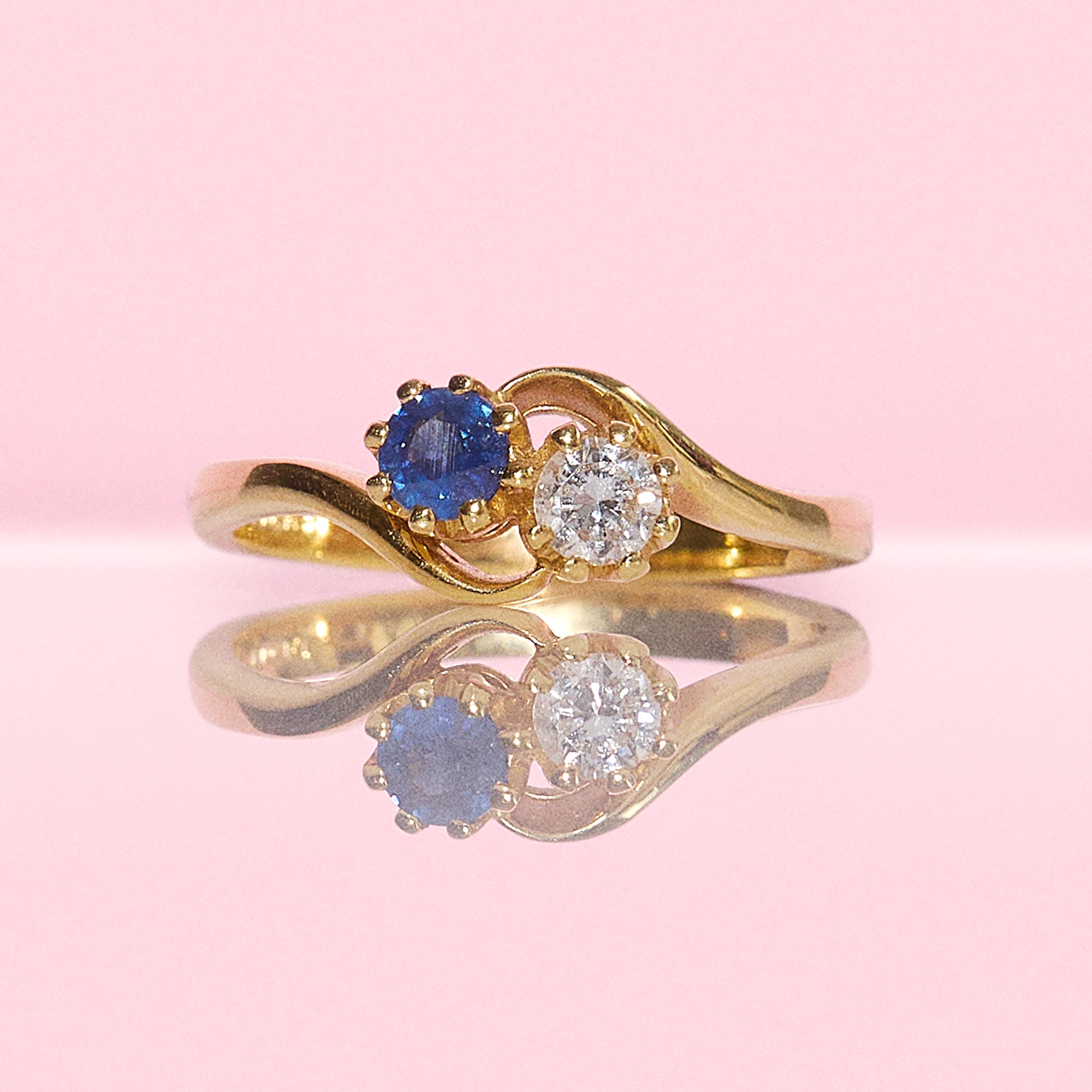 18ct gold Diamond and Sapphire cross over ring