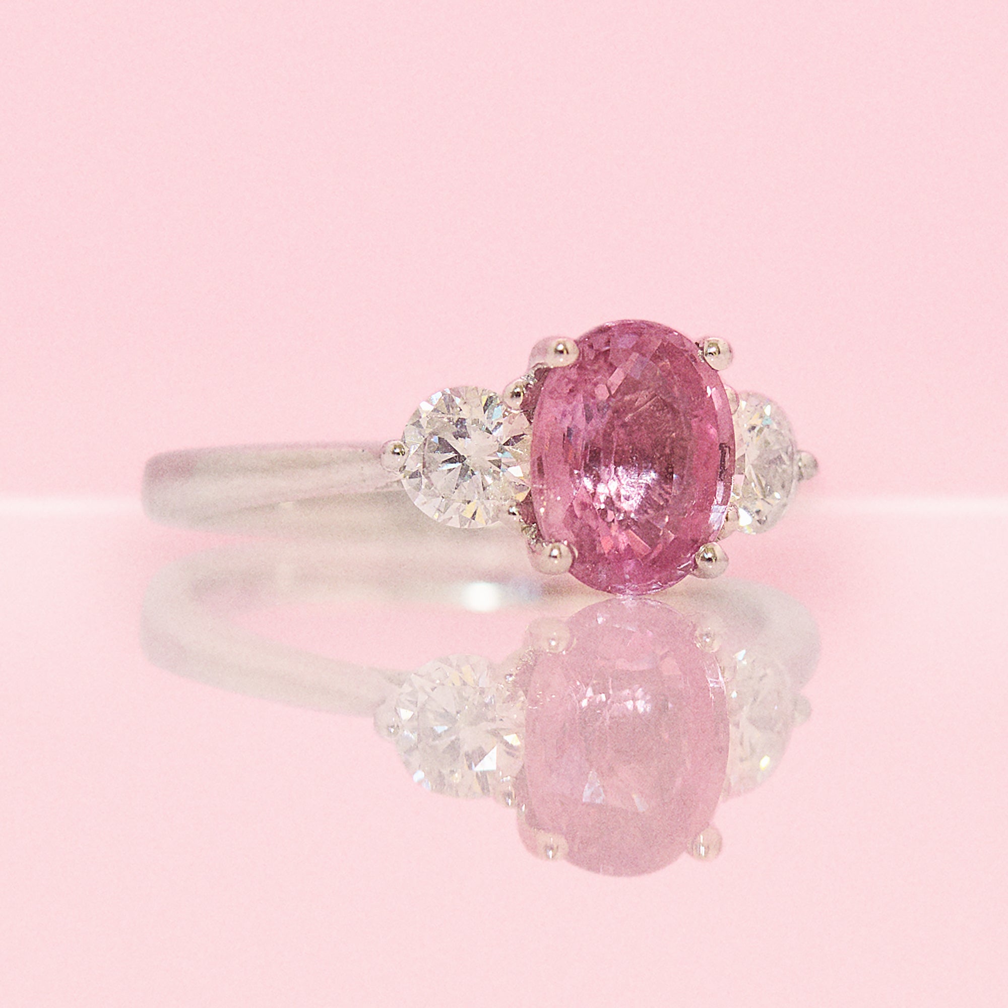 Platinum 1.24ct pink sapphire and 0.43ct diamond three stone ring (made to order)