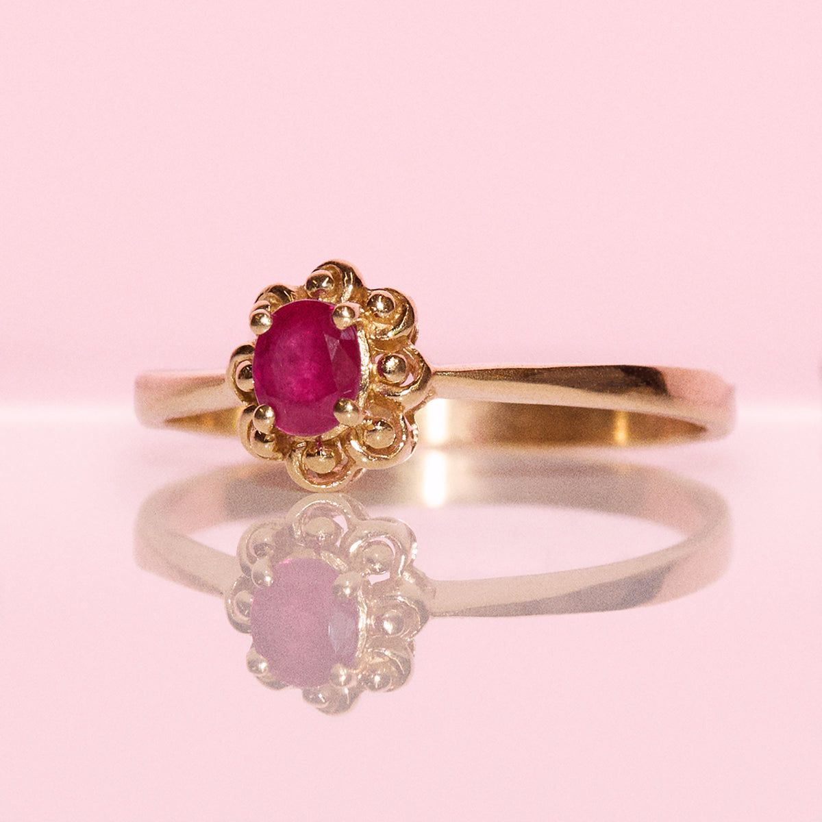 Vintage 18ct gold 0.60ct ruby and diamond flower ring