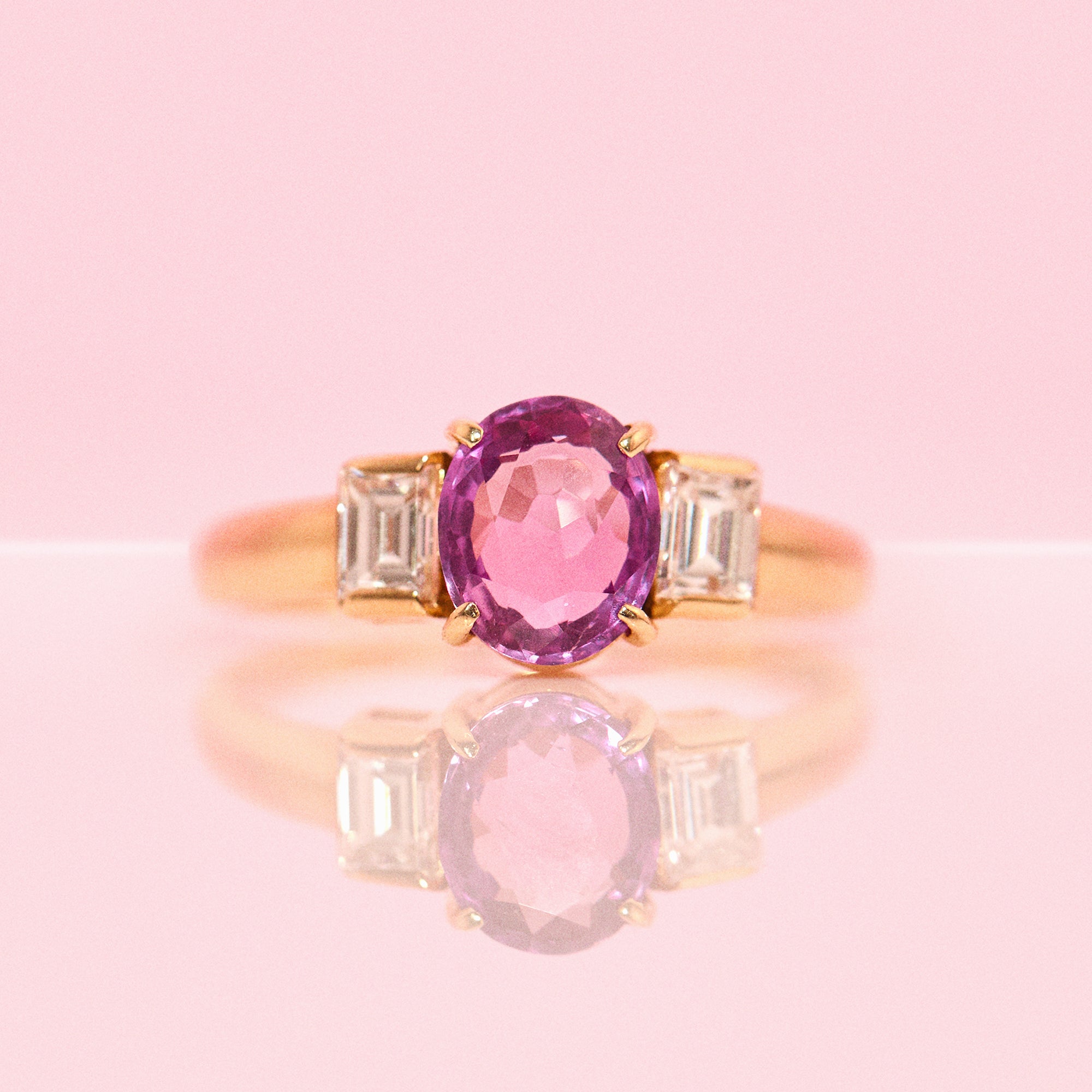 18ct gold pink sapphire and diamond three stone ring