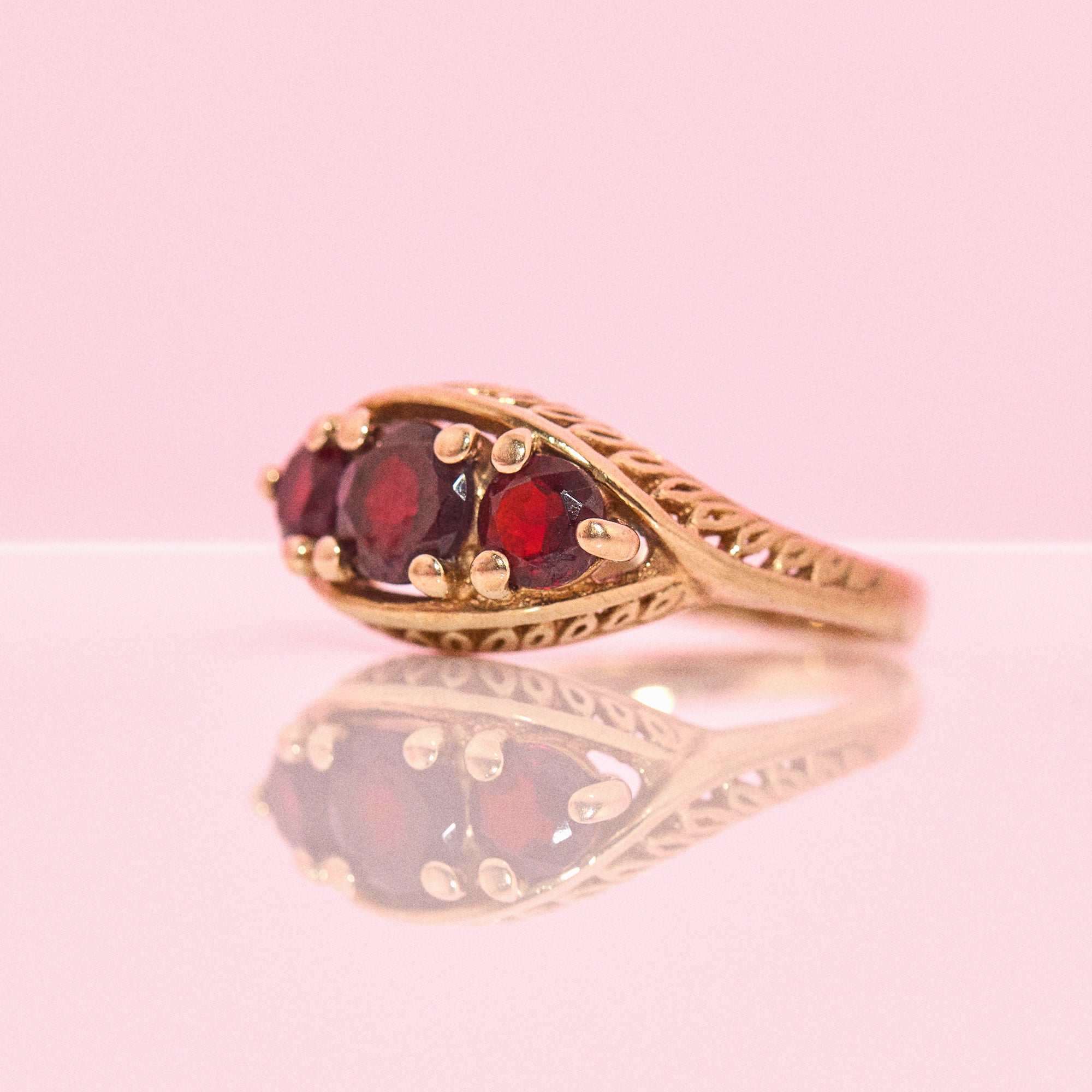 9ct gold three stone garnet ring