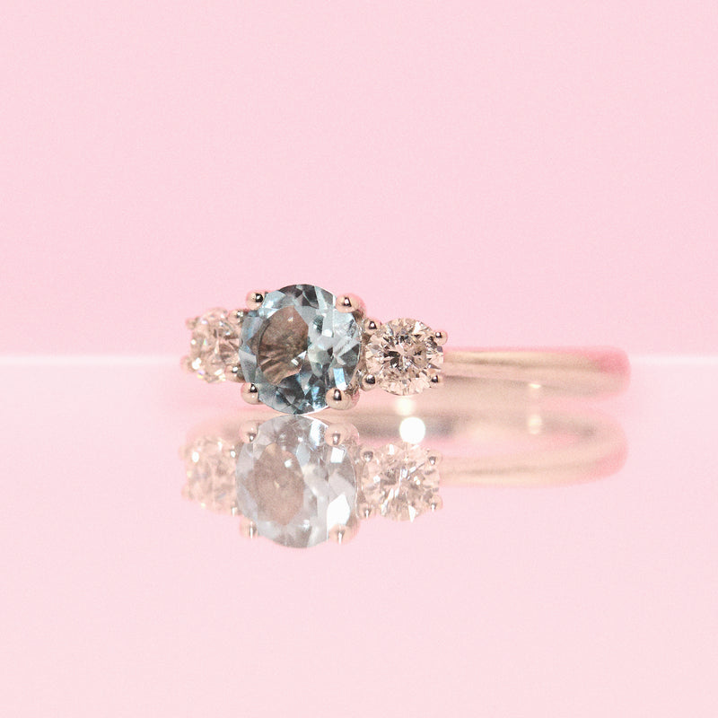 Platinum aquamarine and diamond three stone ring