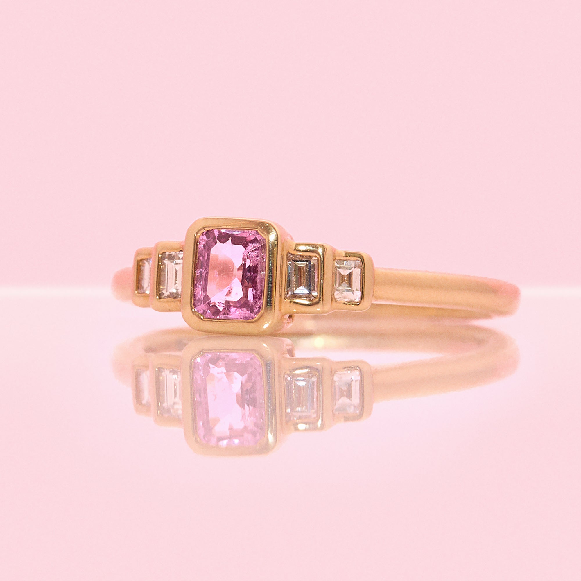 9ct gold 0.52ct emerald cut pink sapphire and baguette diamond three stone ring (made to order)