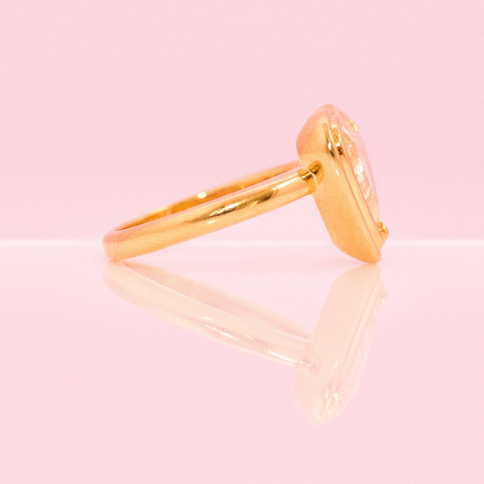 18ct gold bezel set fancy yellow 2.35ct heart-shaped diamond ring